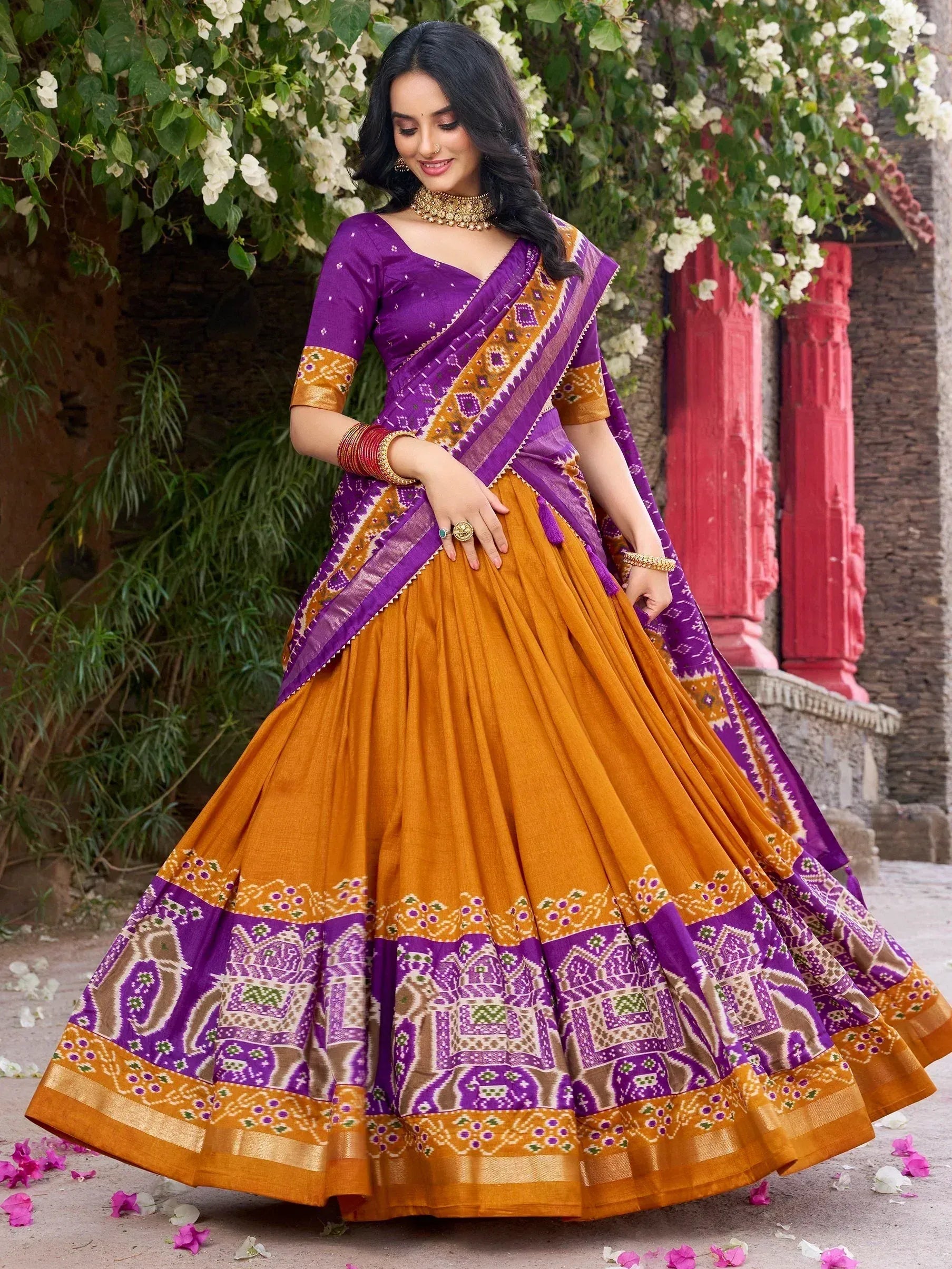 Purple and mustard Indian lehenga choli with ikat print, perfect for festive occasions and weddings.