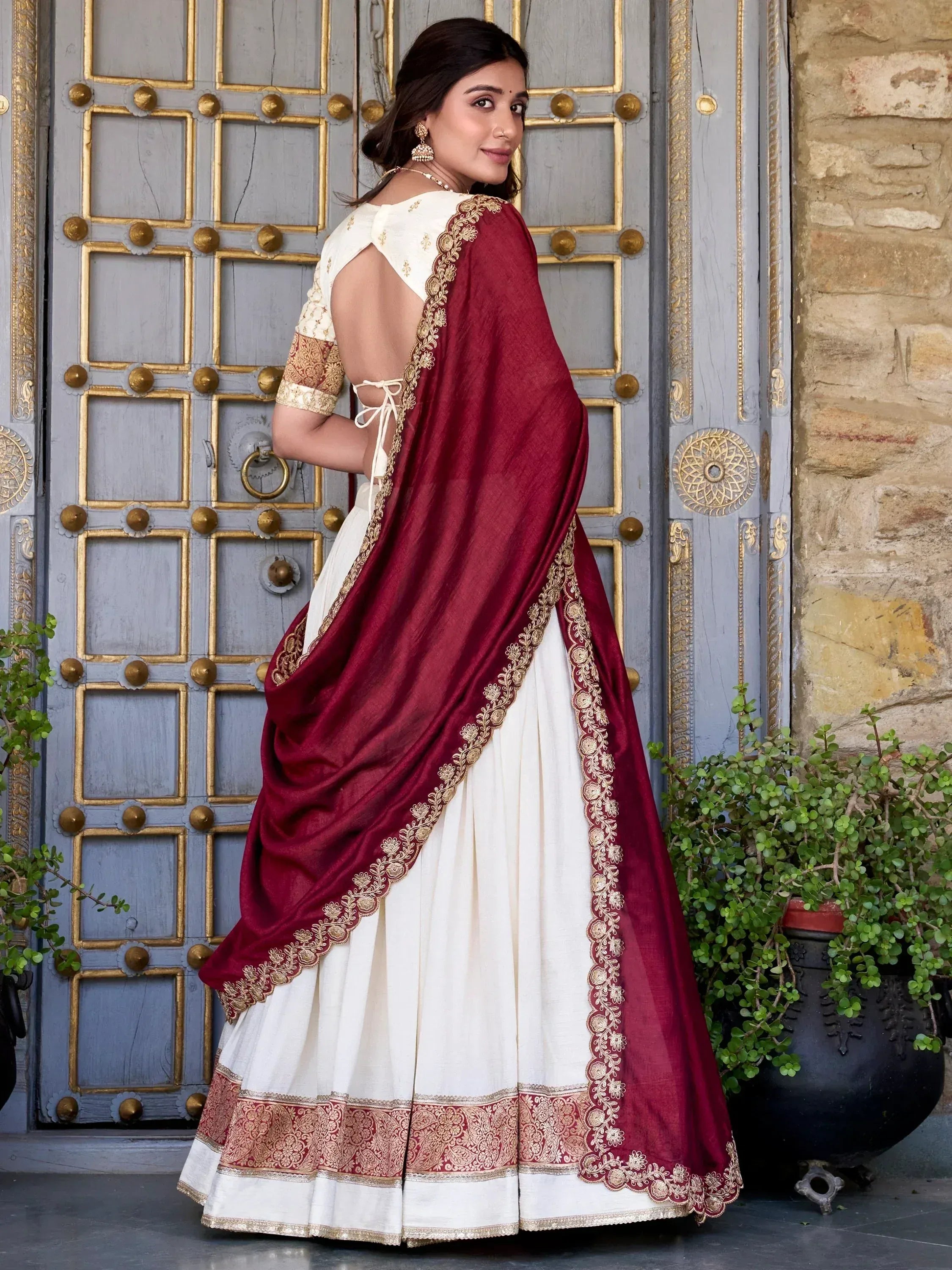 White lehenga choli with maroon dupatta, gold embroidery, backless blouse, ethnic Indian wear