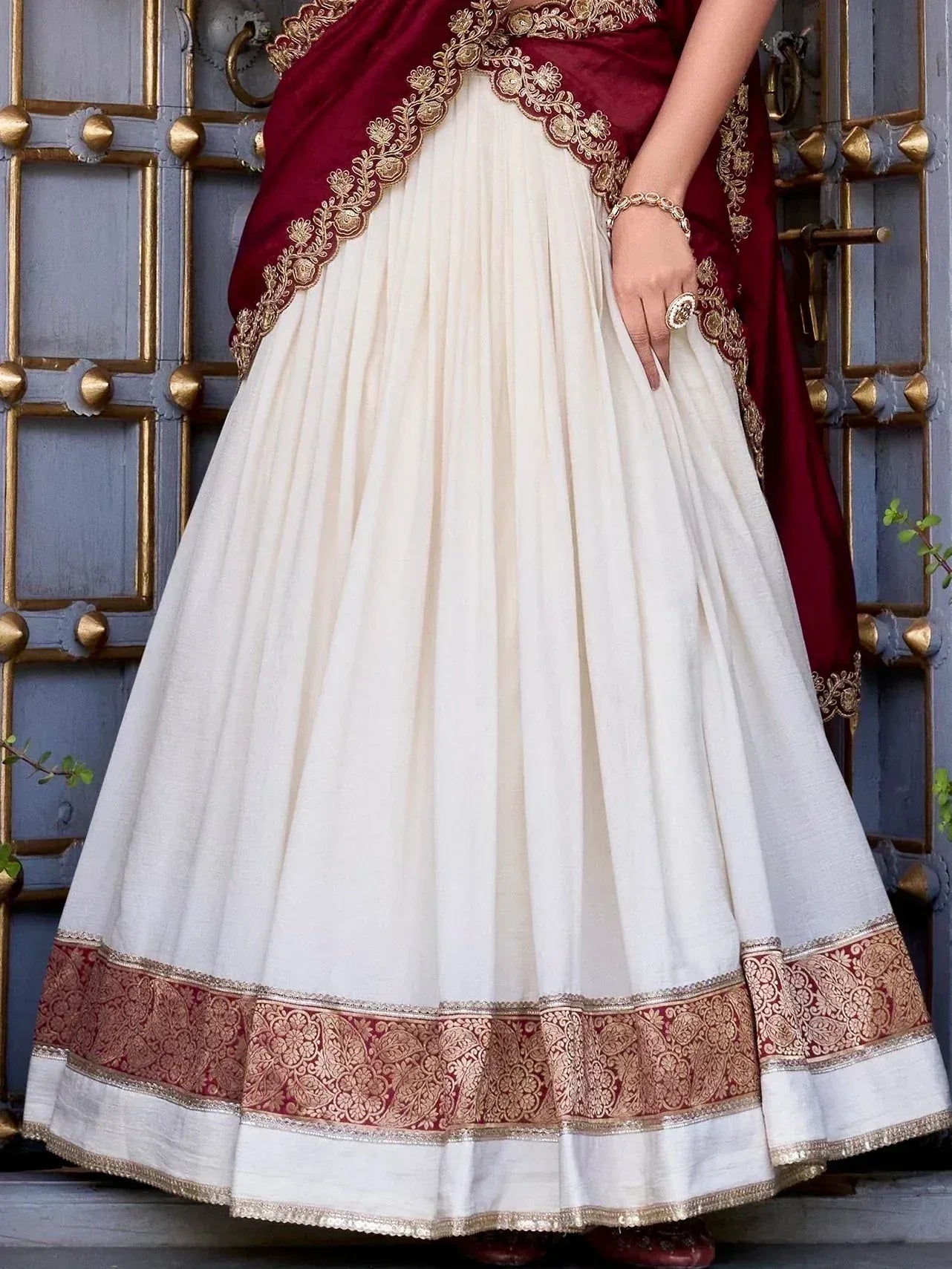 White and maroon ethnic lehenga with gold embroidery, perfect for Indian weddings and festive occasions