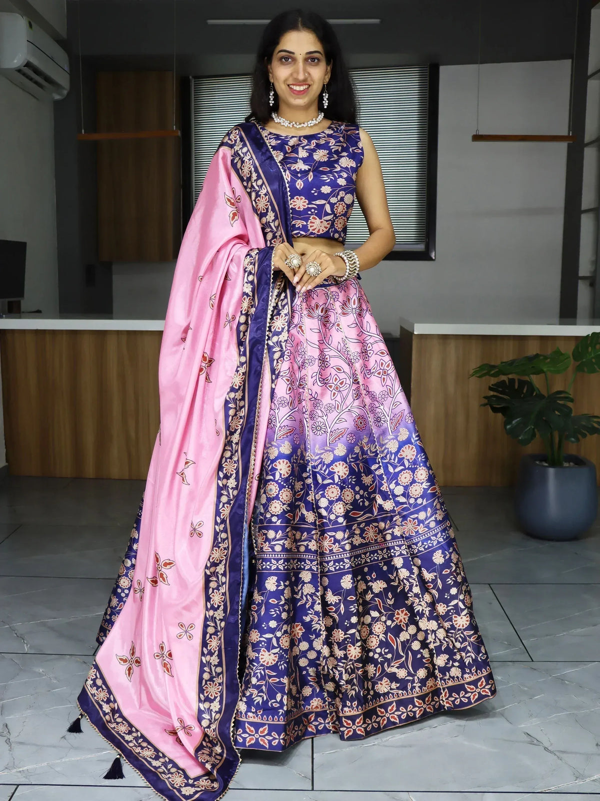 Woman in purple and pink floral lehenga choli with matching dupatta, Indian ethnic wear
