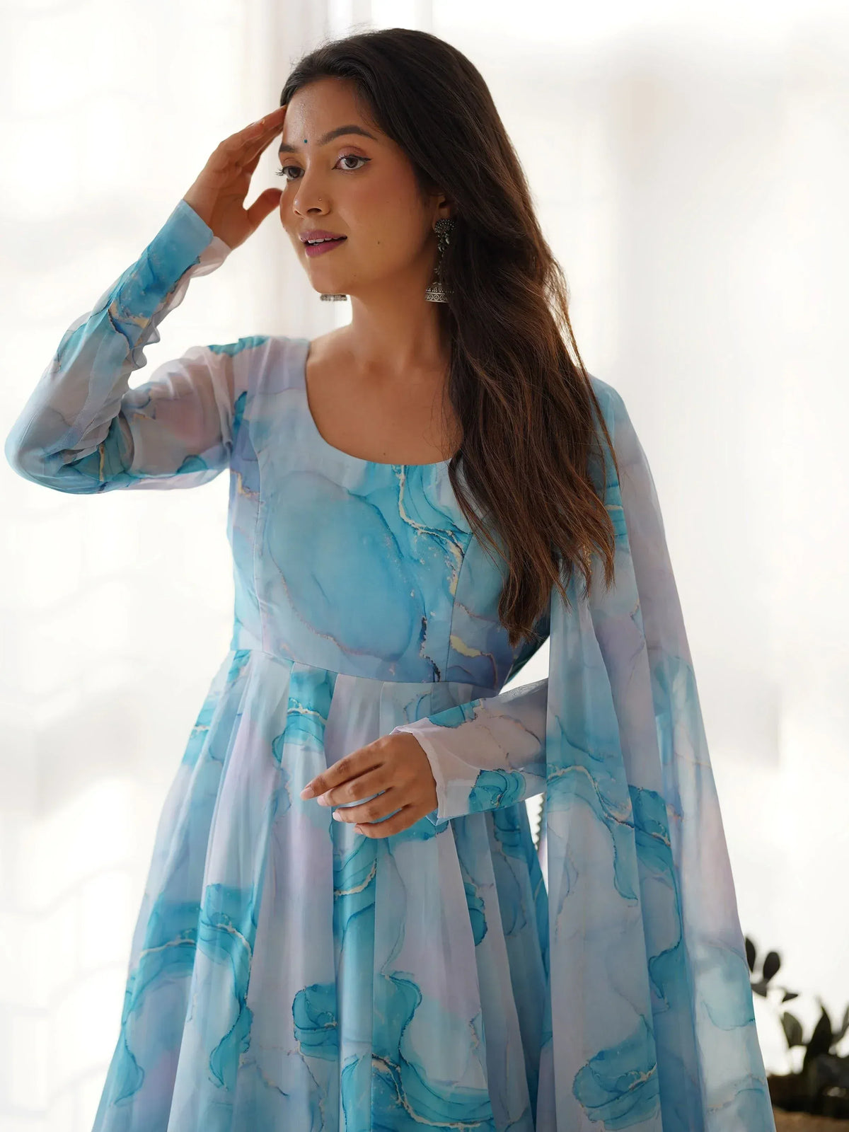Blue marble print ethnic gown with flared sleeves, perfect for festive occasions