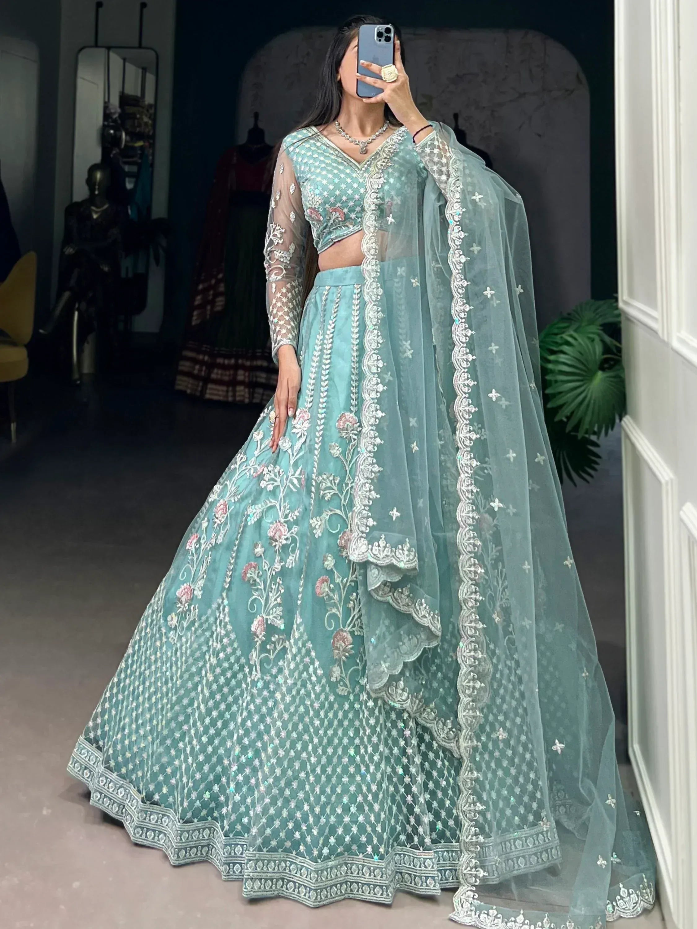 Mint green designer lehenga choli with floral embroidery and sheer dupatta for Indian ethnic wear