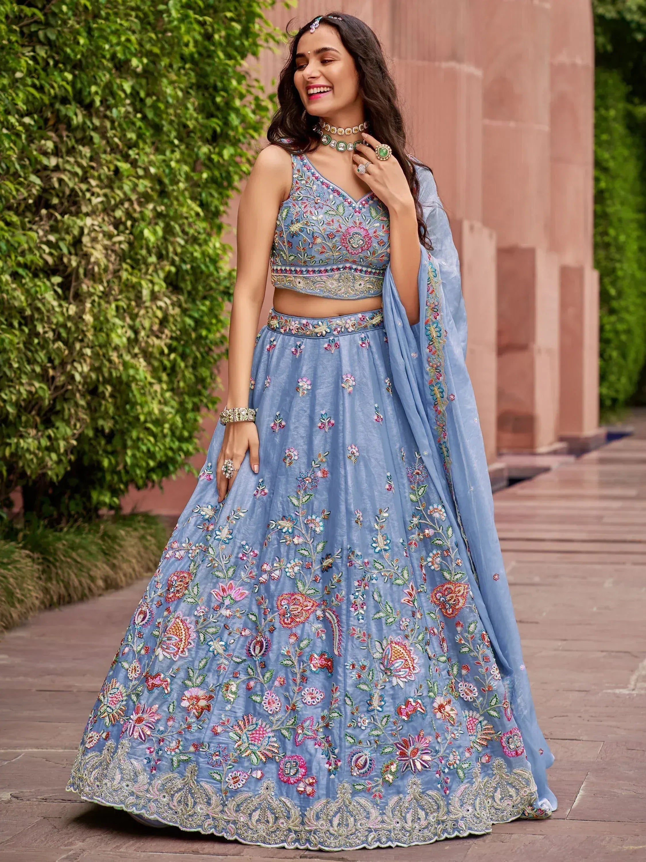 Light blue embroidered lehenga choli with floral motifs, perfect for Indian ethnic wear events