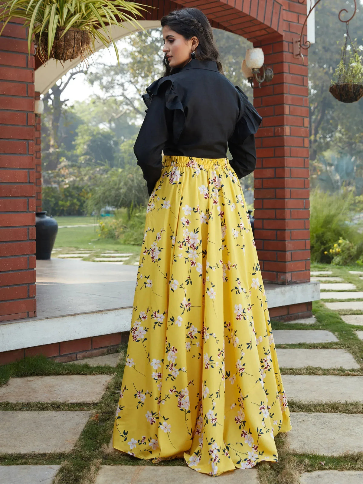 Yellow floral printed skirt with black ruffle top, ethnic wear for women