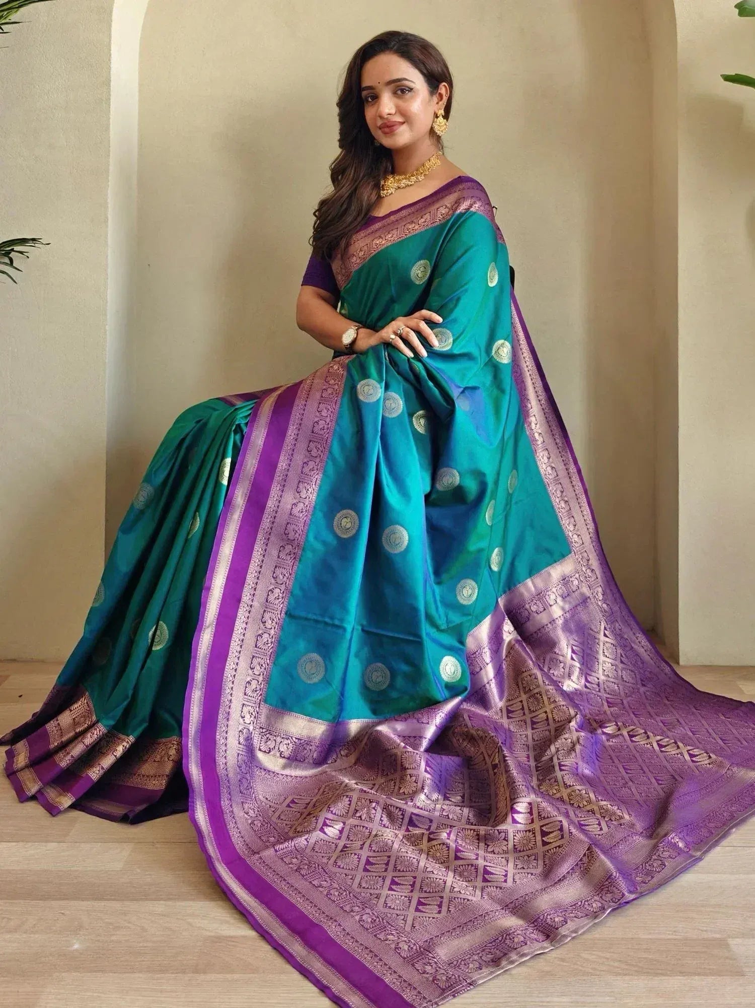 Teal and purple designer saree with gold motifs and woven border, perfect for Indian ethnic wear occasions.