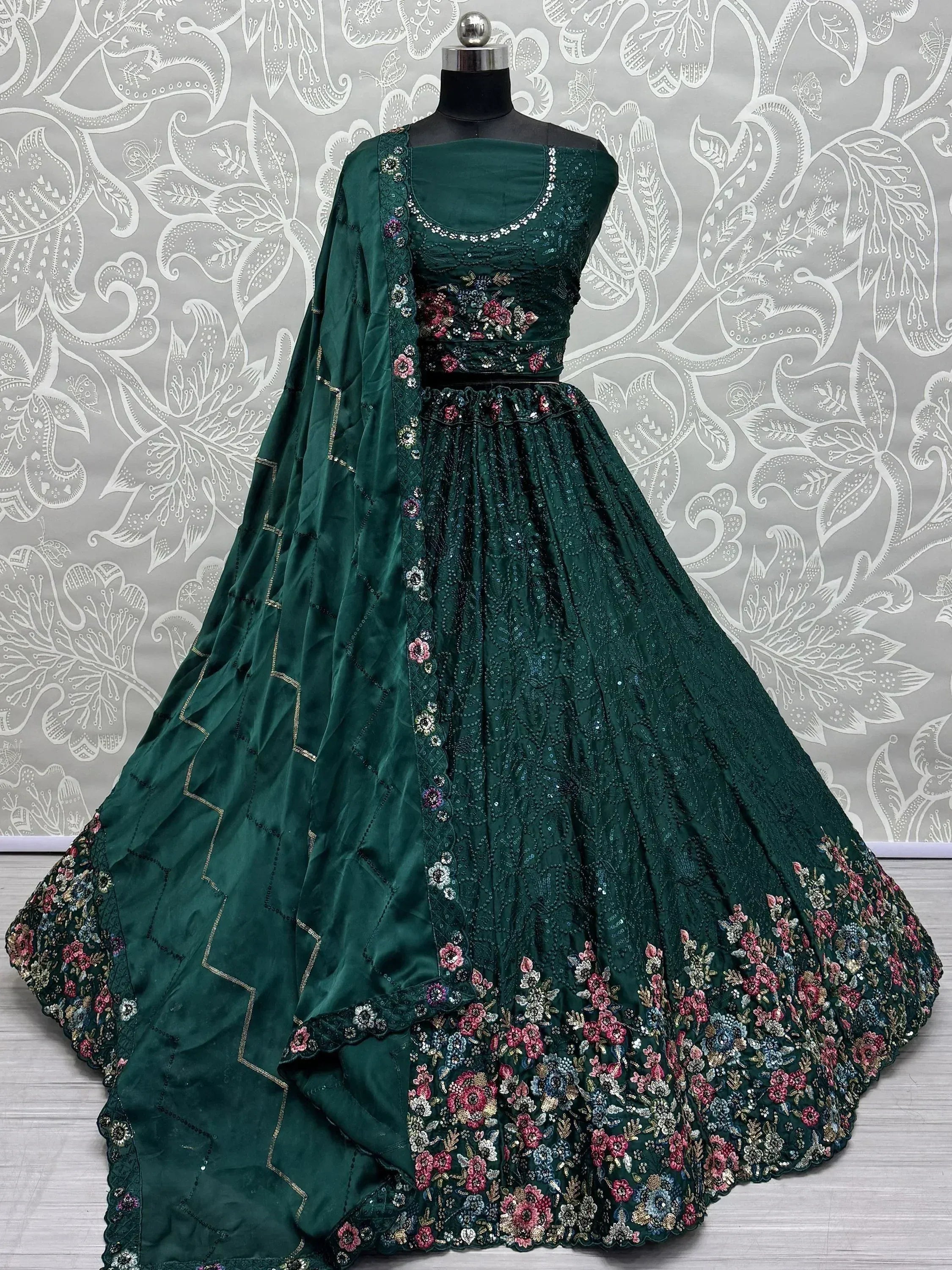 Emerald green designer lehenga choli with floral embroidery and sequins, perfect for Indian ethnic wear