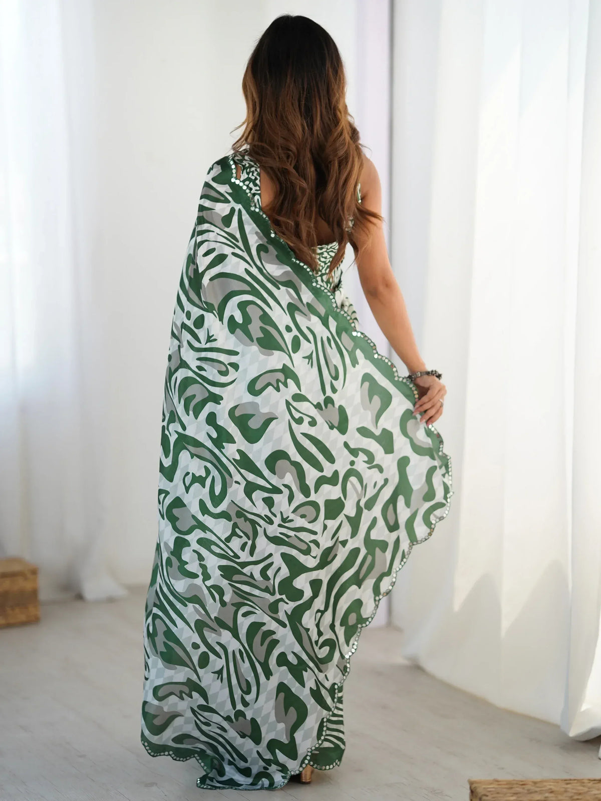 Green and white printed ethnic gown with sequin detailing, perfect for Indian festive wear.