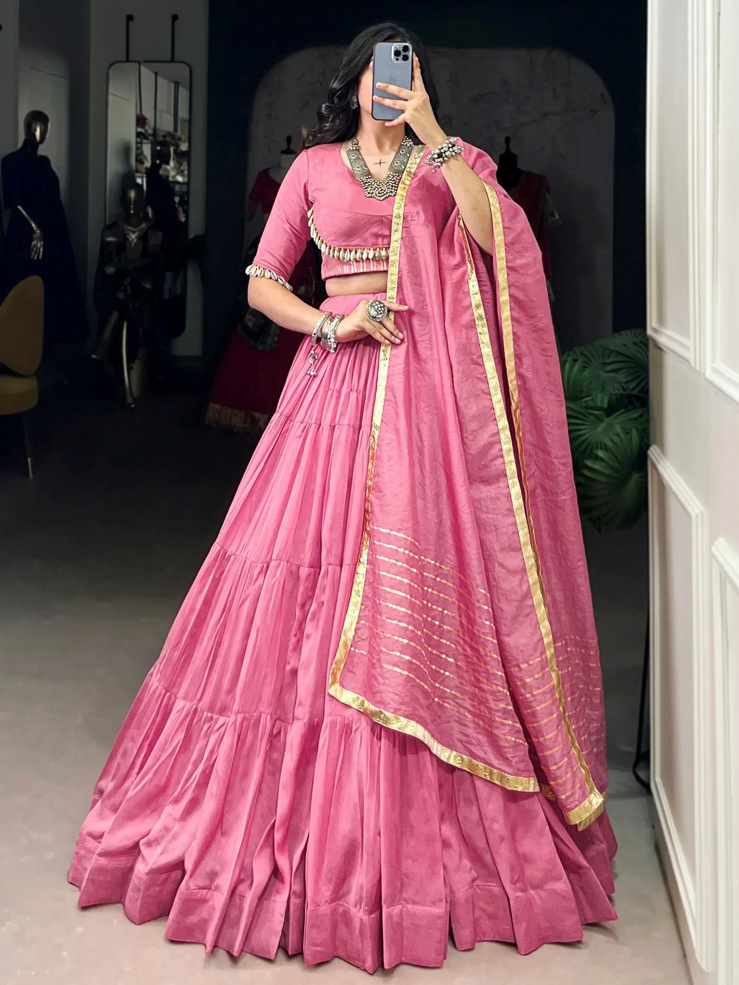 Pink designer lehenga choli with gold trim, perfect for Indian ethnic wear and festive occasions.