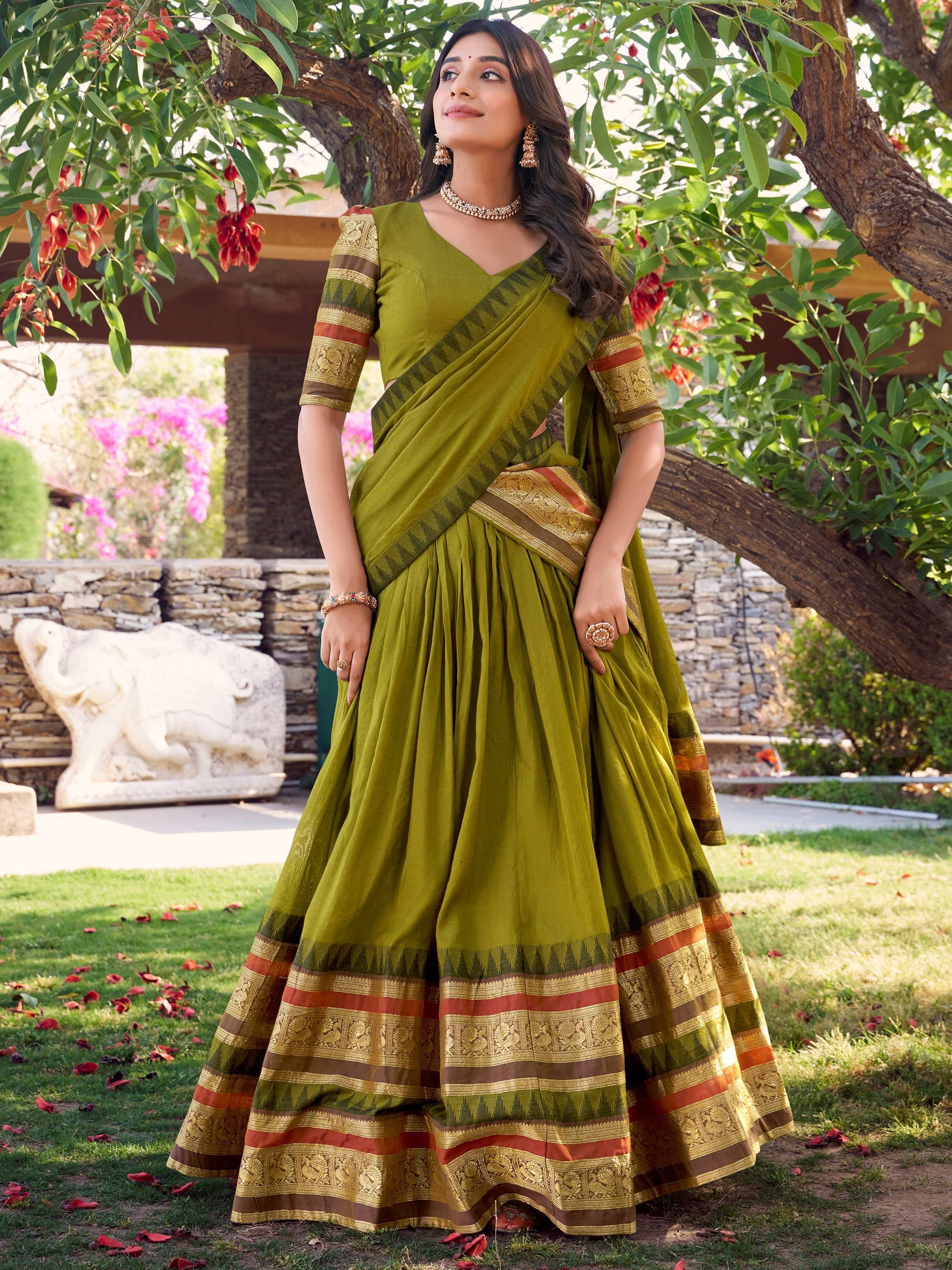 Olive green designer lehenga choli with gold and red border, perfect for Indian ethnic wear occasions