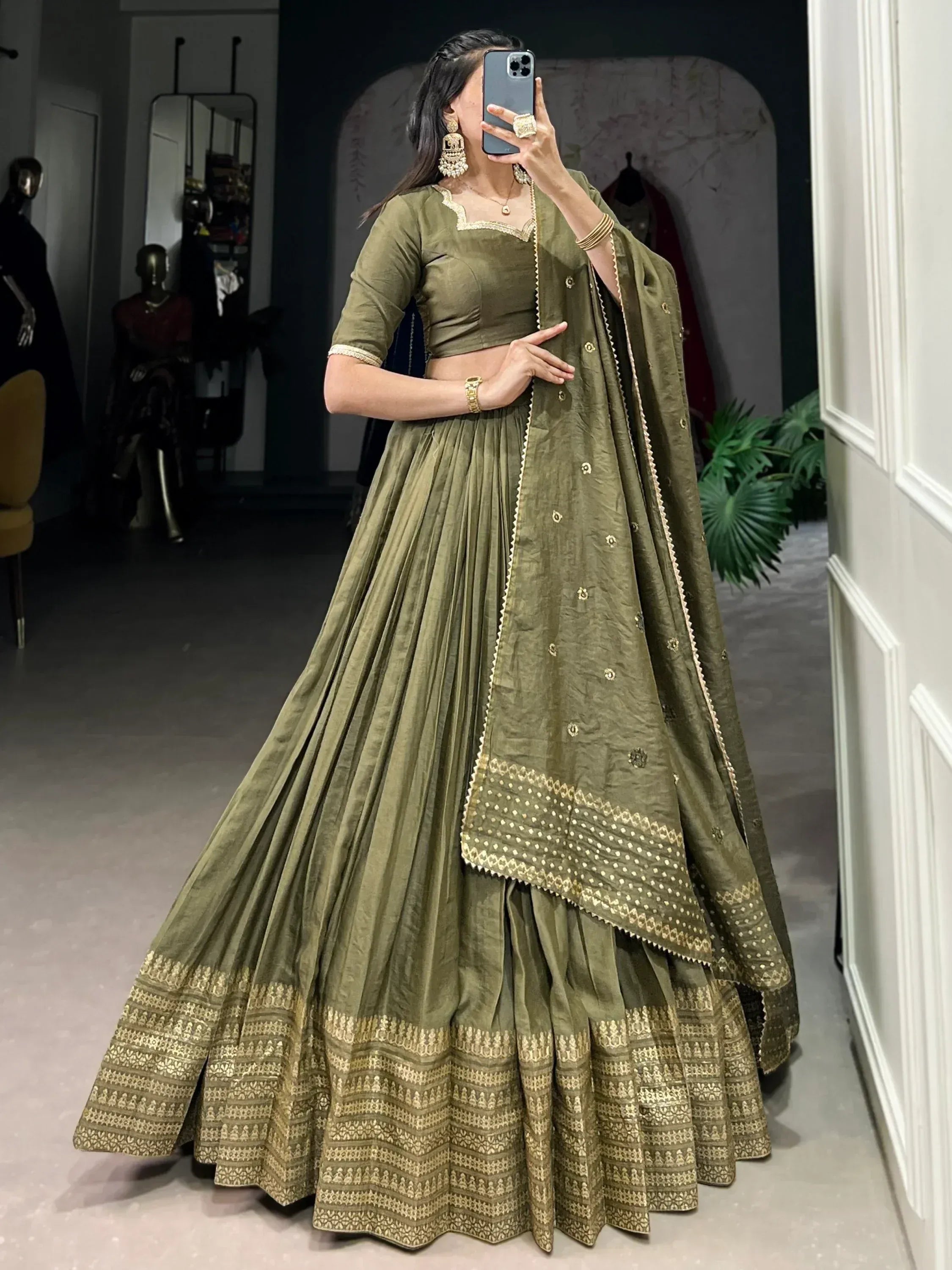 Olive green designer lehenga choli with gold embroidery, perfect for Indian ethnic wear occasions.