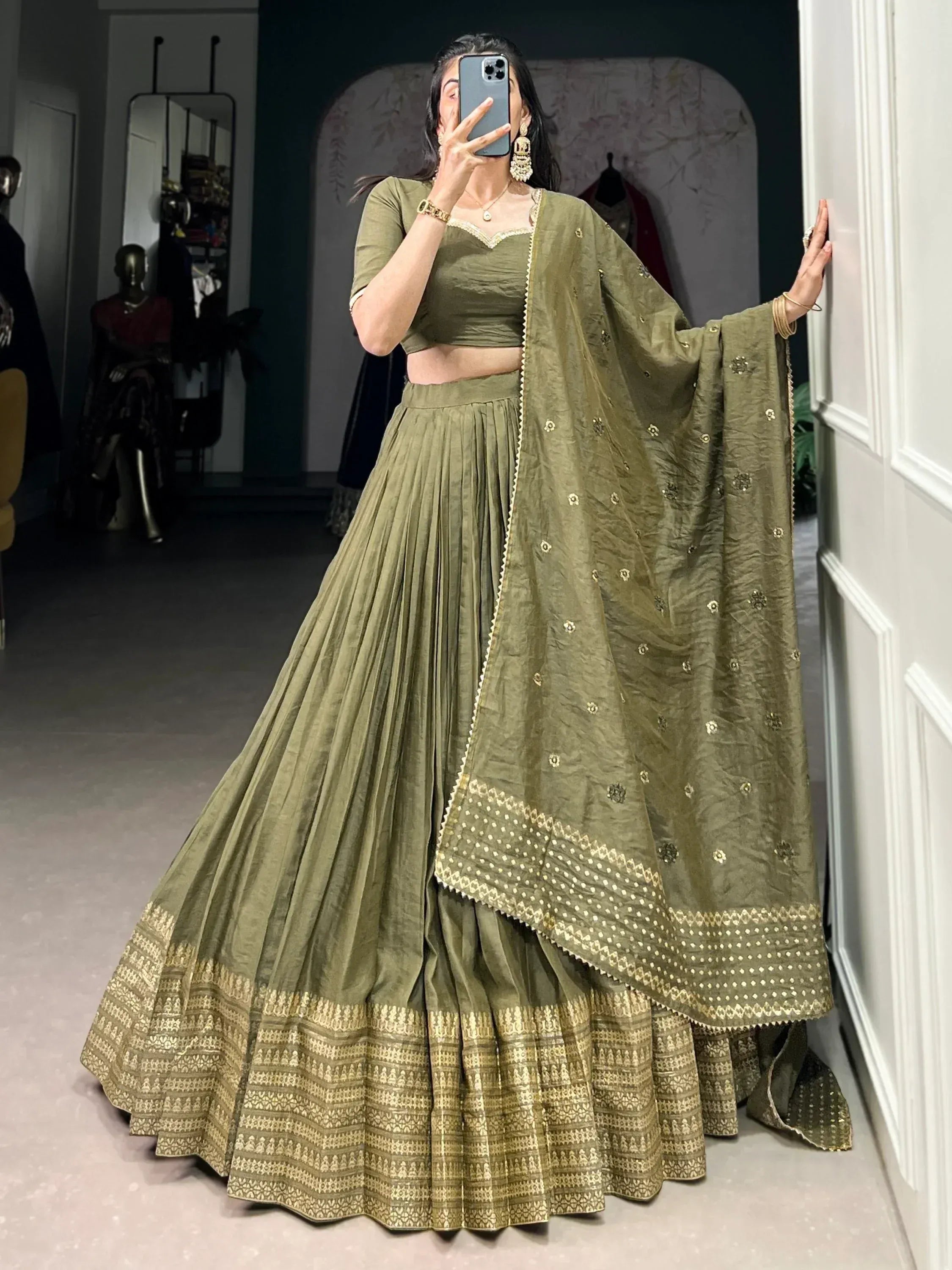 Olive green designer lehenga choli with gold embroidery and pleated skirt, perfect for Indian ethnic wear