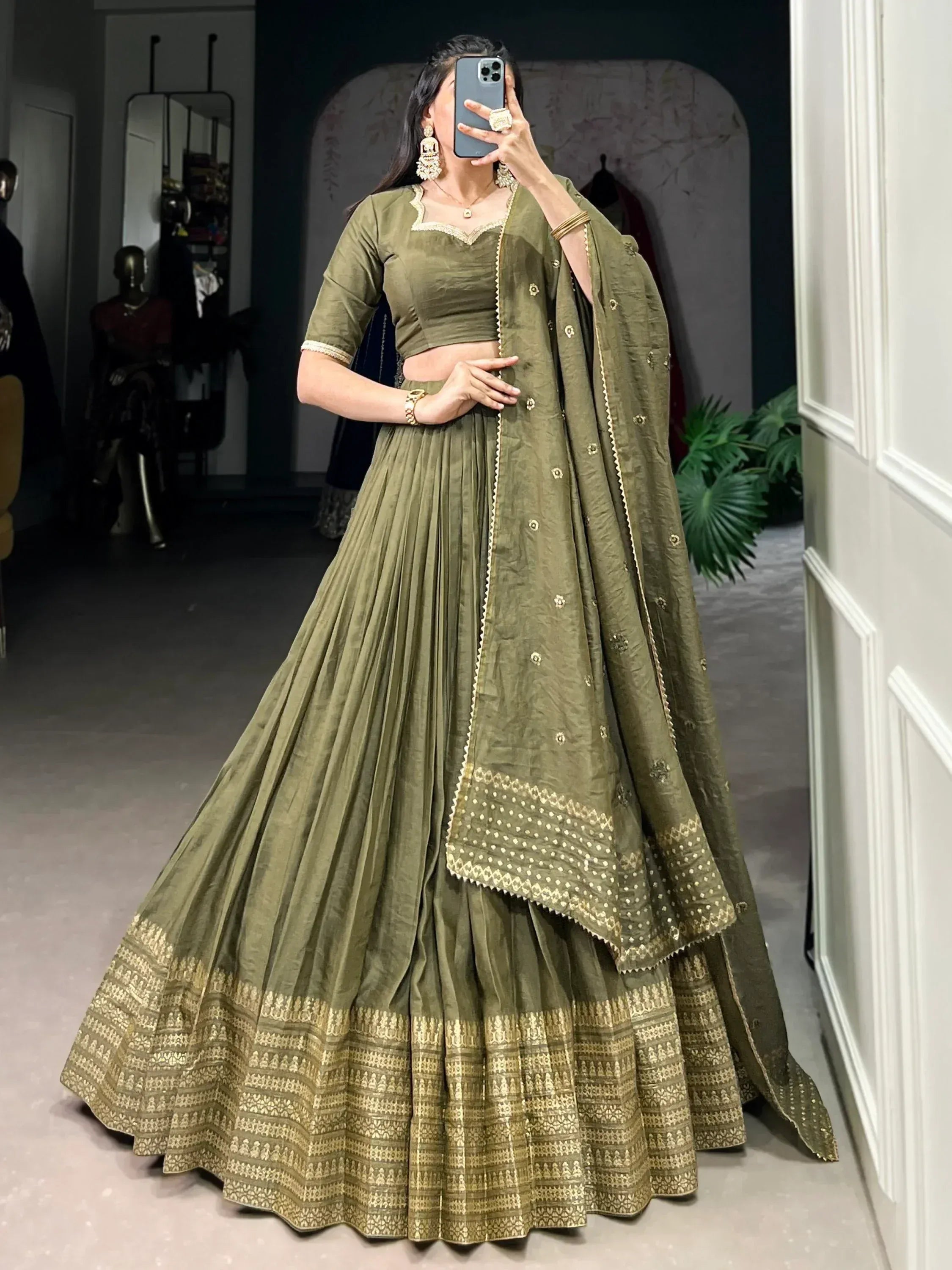 Olive green designer lehenga choli with gold embroidery, perfect for Indian ethnic wear occasions.