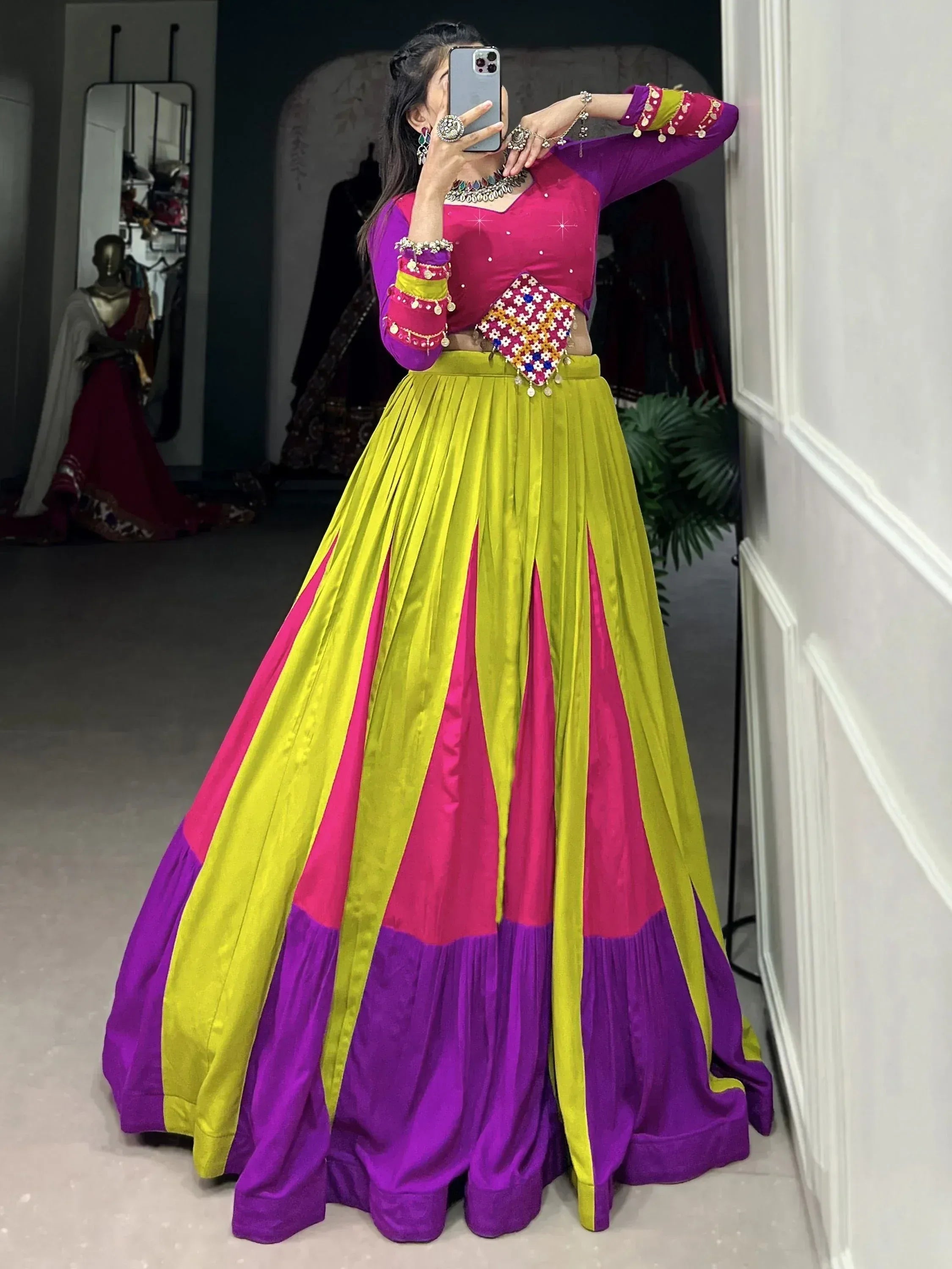 Vibrant Indian lehenga choli with pink, yellow, and purple panels, perfect for festive occasions and weddings.