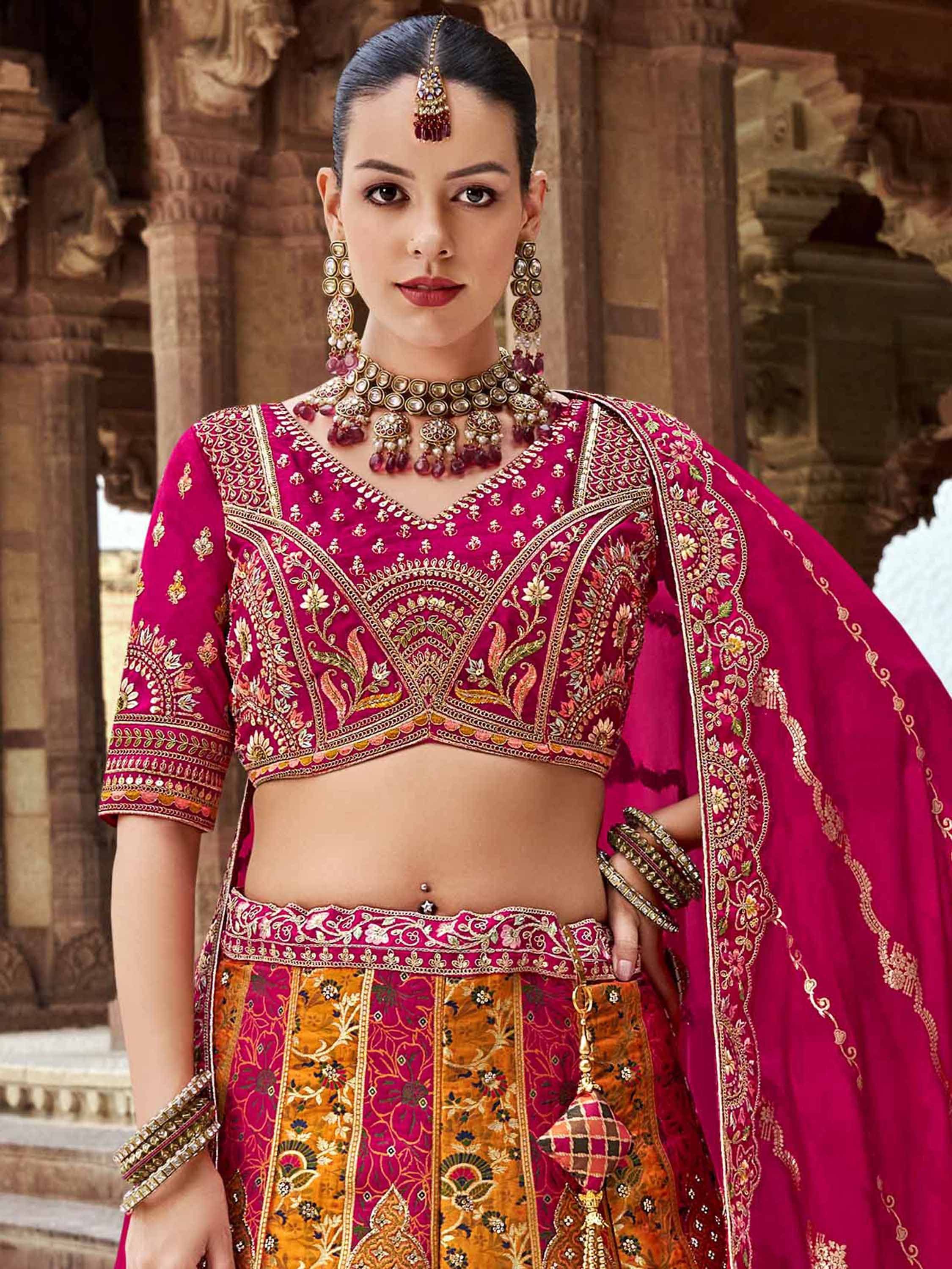 Elegant pink and gold embroidered lehenga choli with matching dupatta, traditional Indian ethnic wear