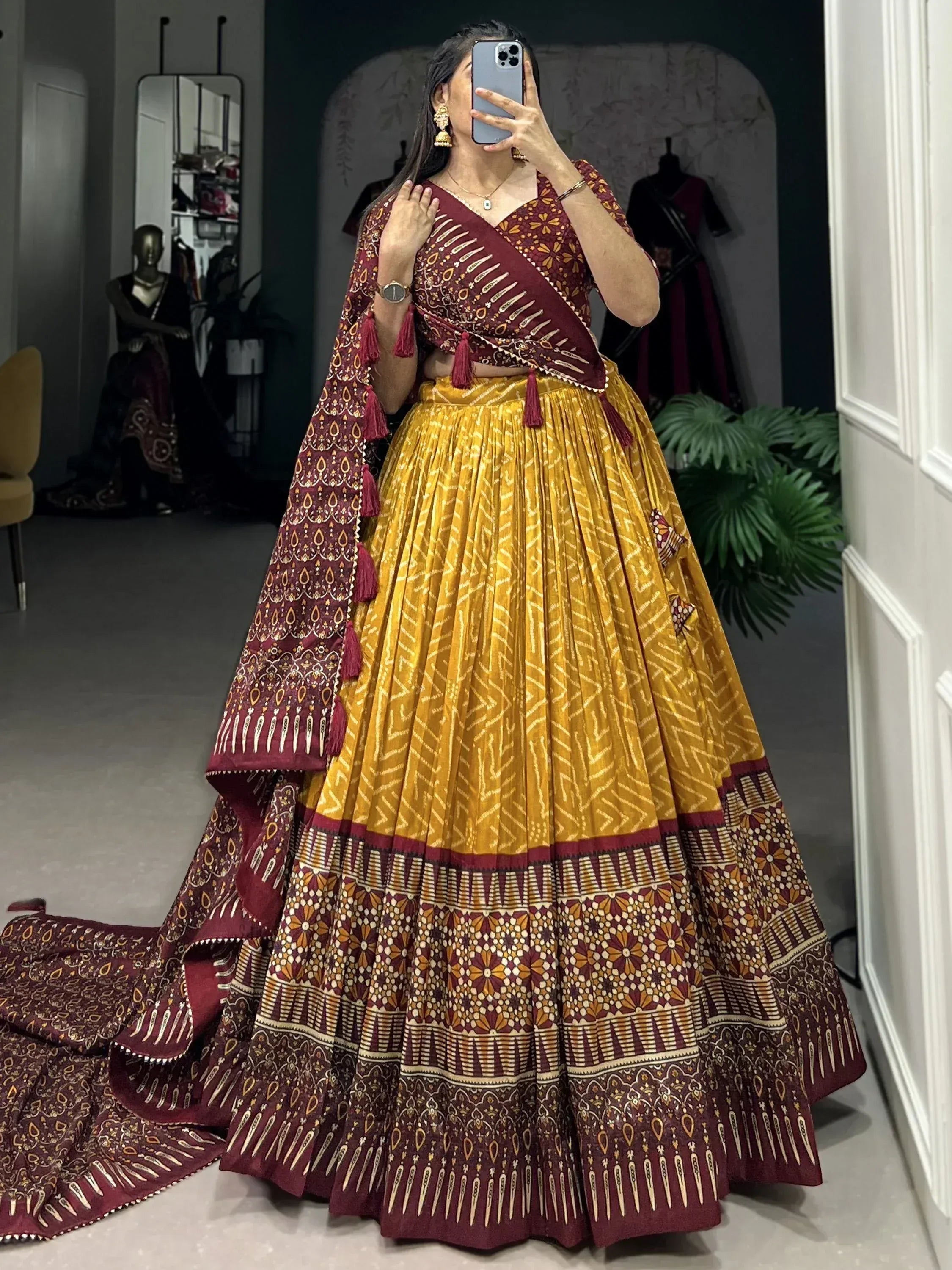 Maroon and mustard yellow printed lehenga choli with tassels, ethnic wear for women