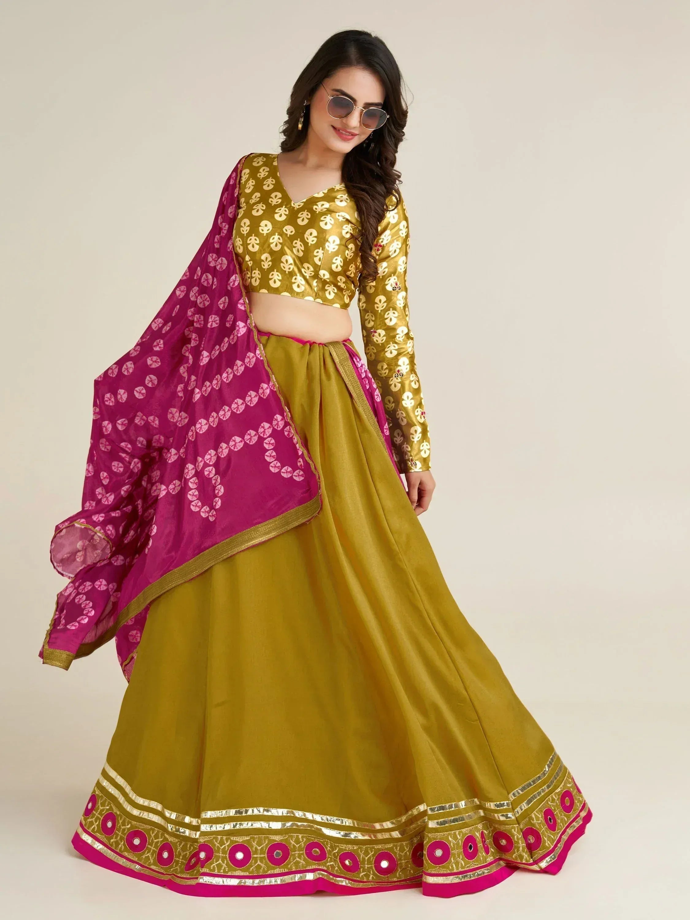 Elegant mustard yellow lehenga choli with pink dupatta, perfect for Indian ethnic wear