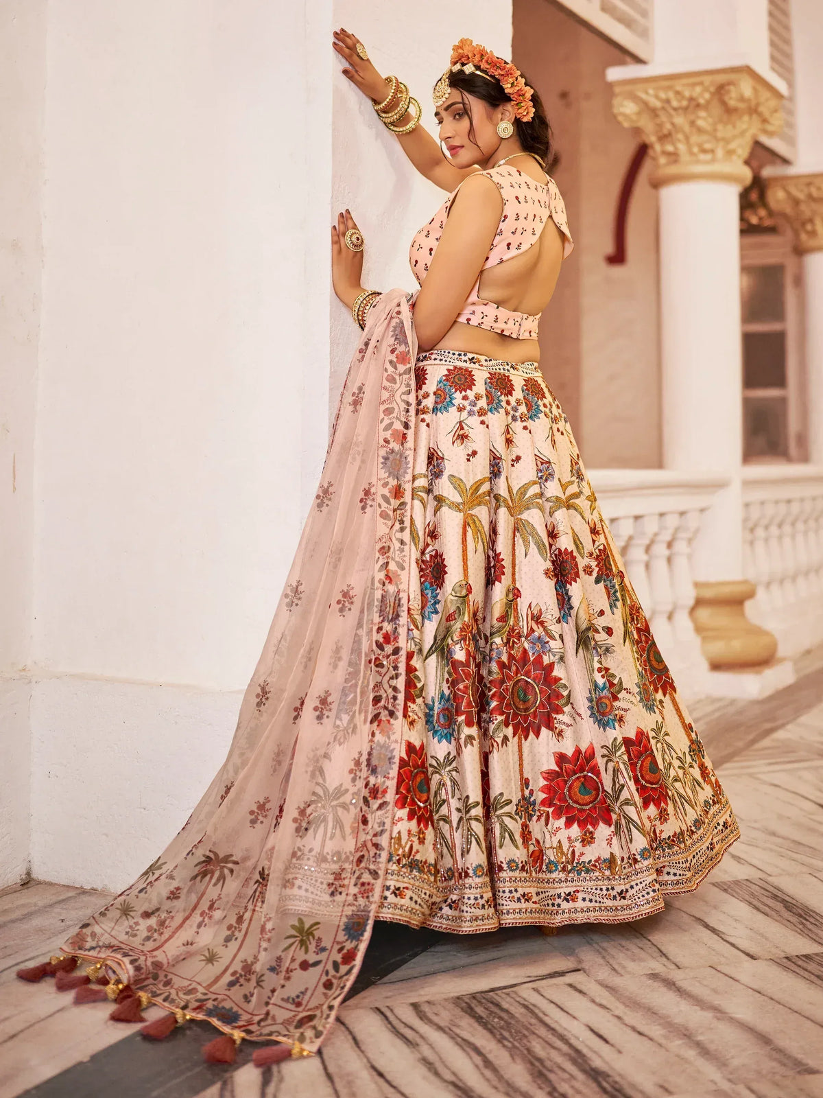 Woman in floral printed lehenga choli with backless blouse, perfect for Indian ethnic occasions