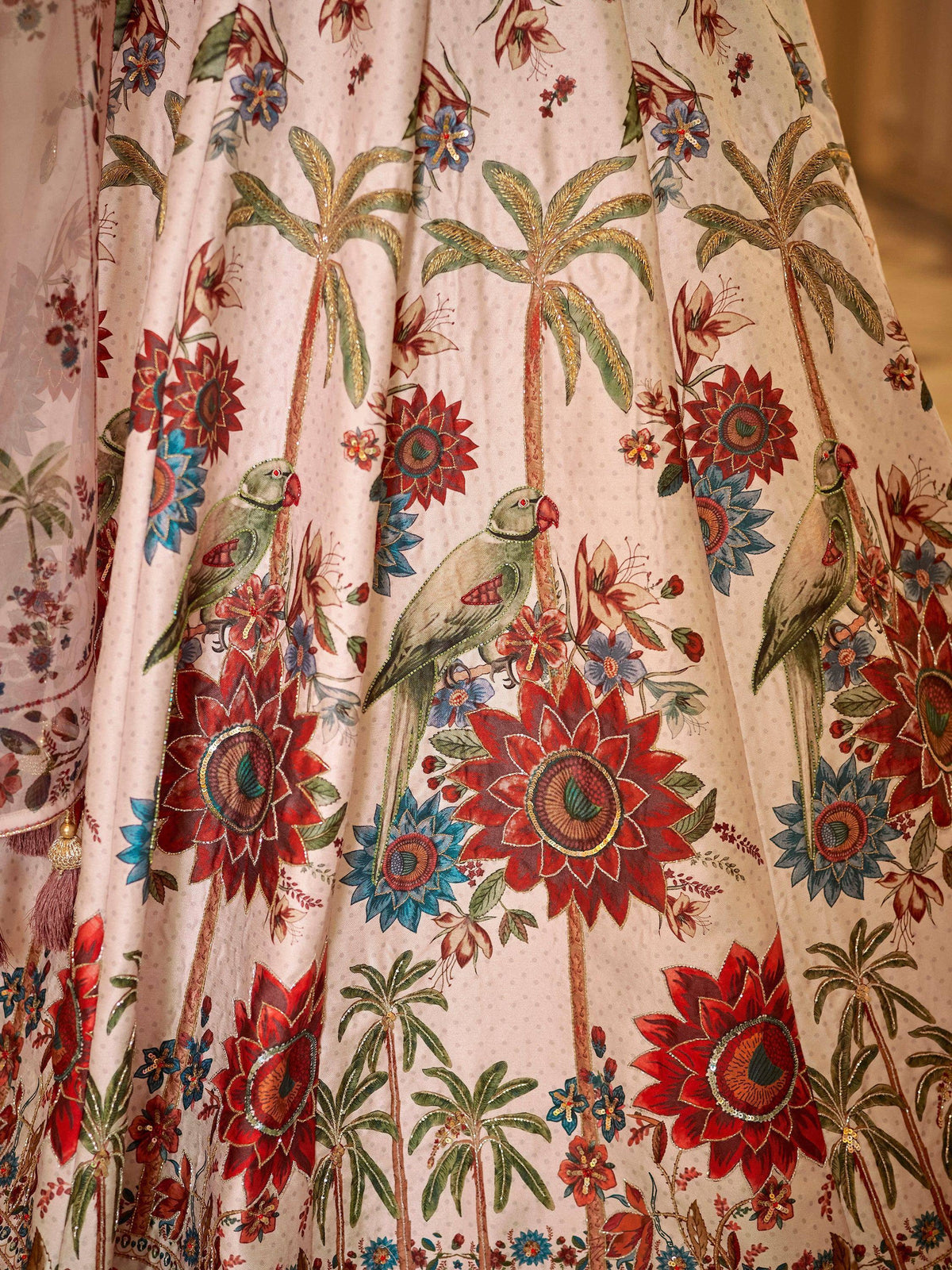 Floral and parrot embroidered lehenga skirt with palm trees, perfect for Indian ethnic wear