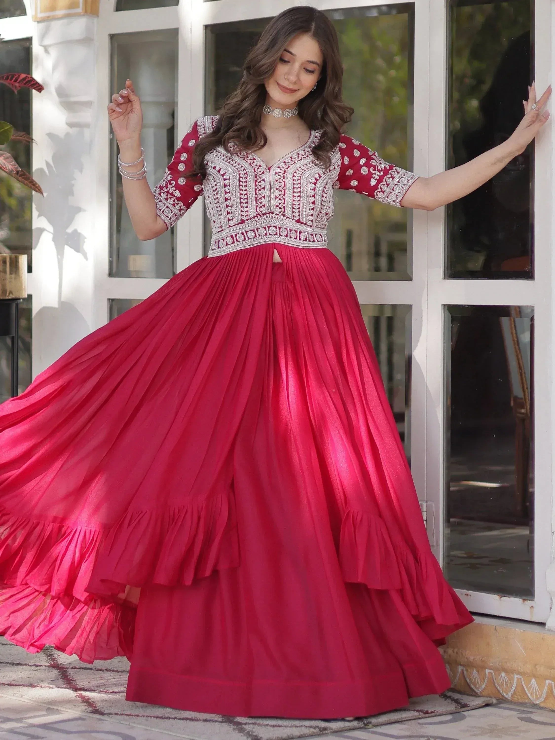 Red embroidered lehenga choli with pleated skirt, perfect for Indian ethnic wear events