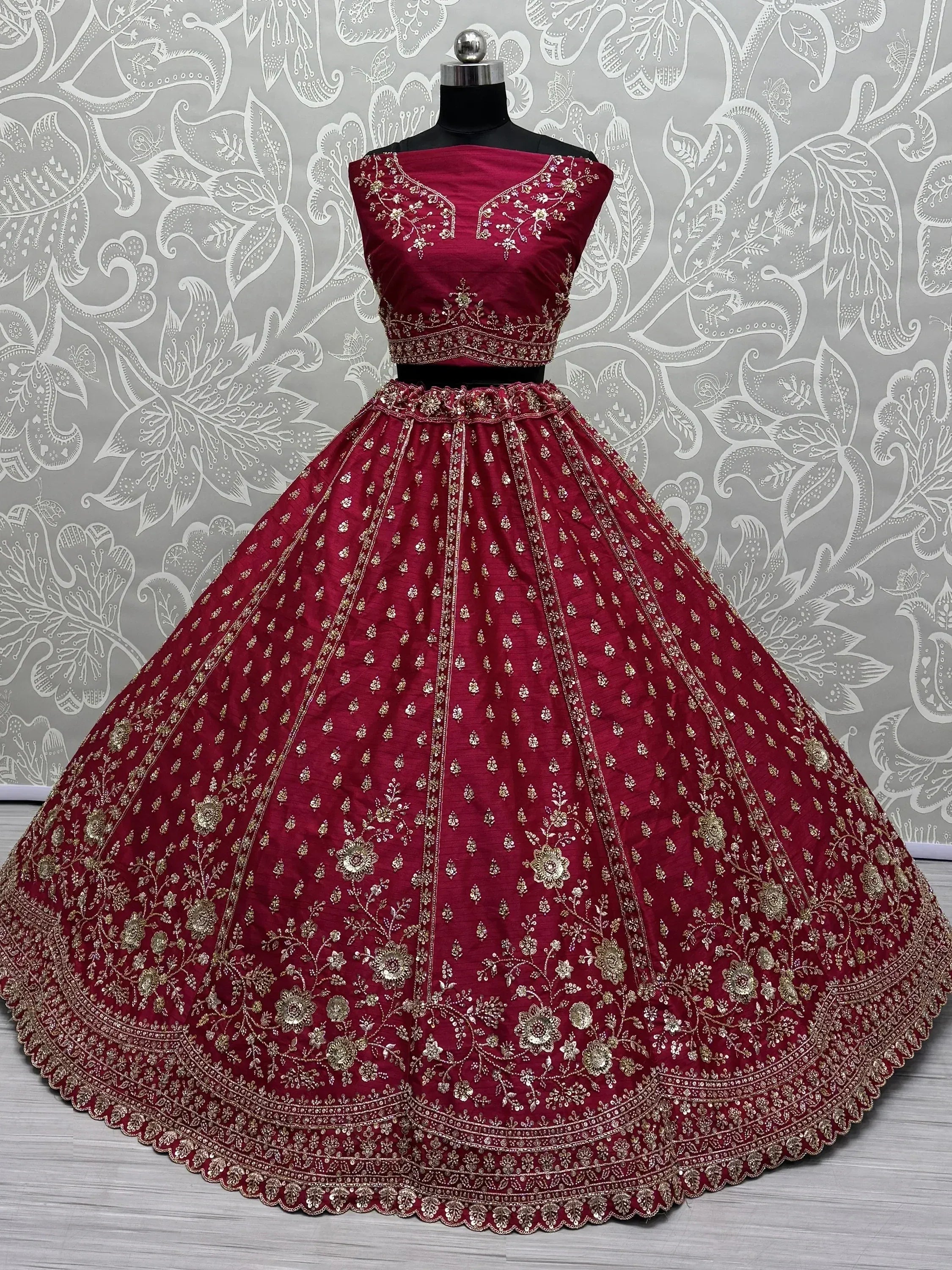 Maroon designer lehenga choli with gold embroidery, perfect for weddings and festive occasions