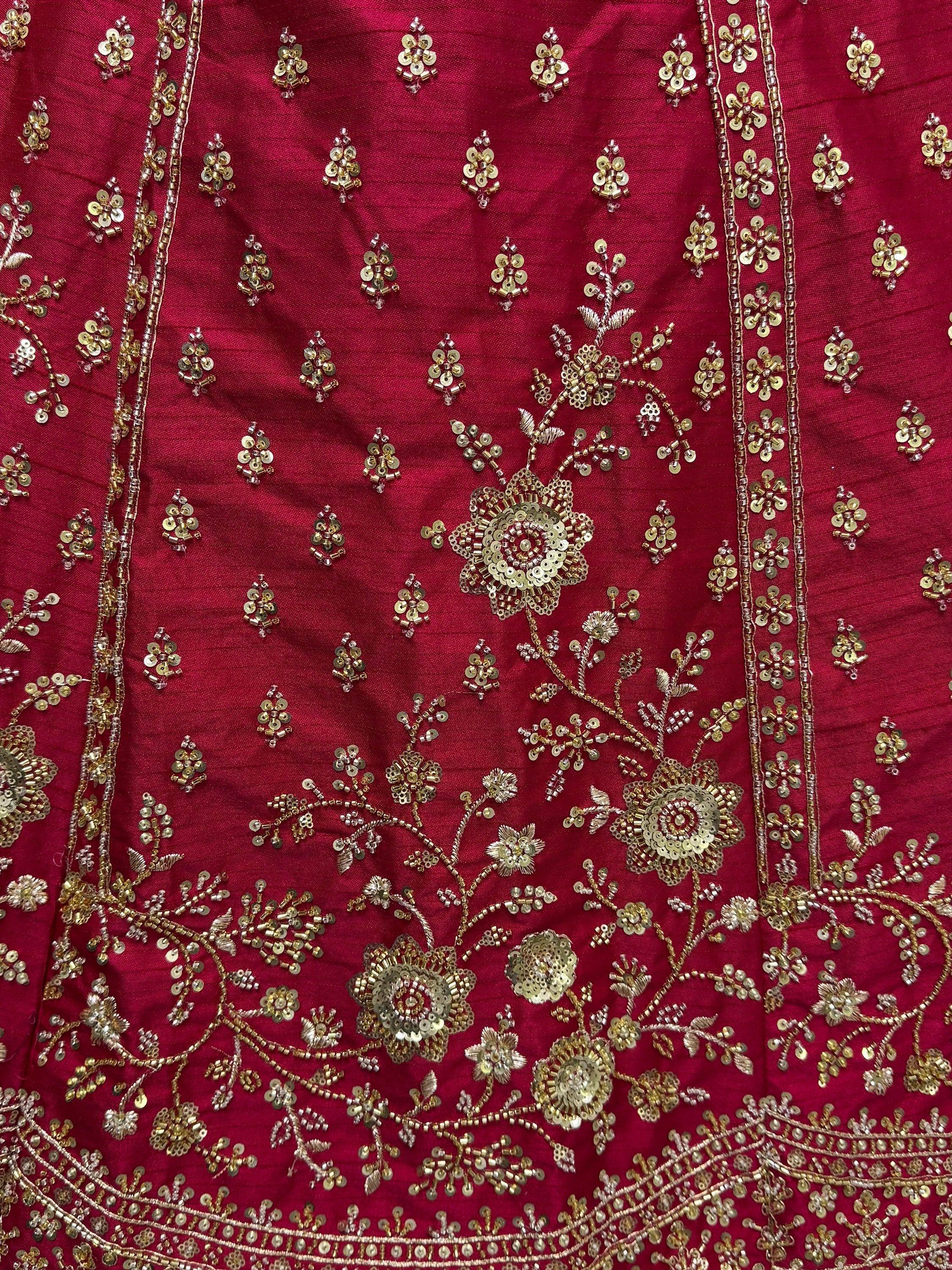 Rich maroon ethnic wear with gold floral embroidery and sequin detailing for festive occasions
