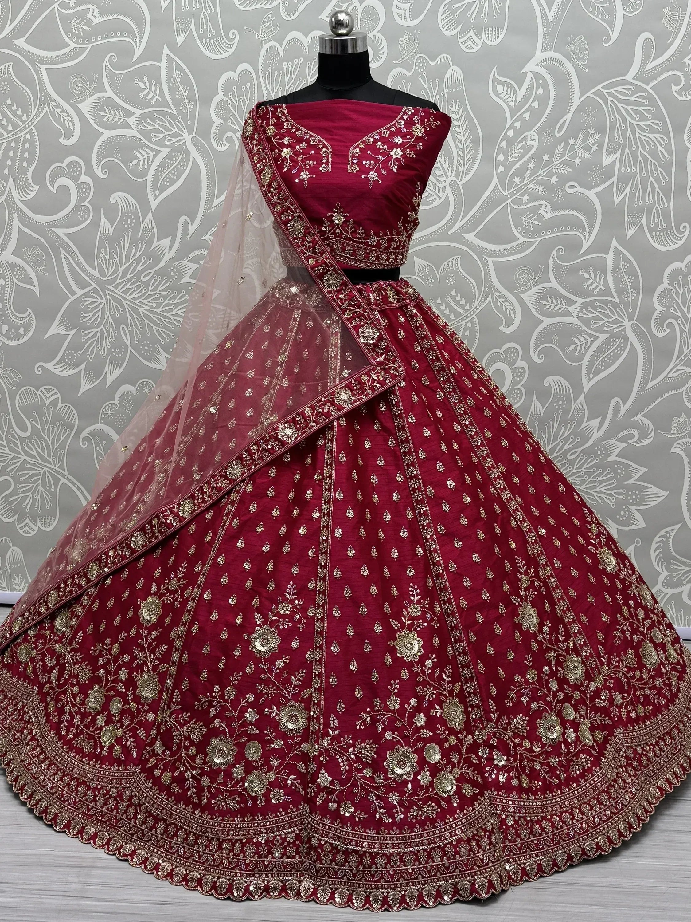 Maroon designer lehenga choli with gold embroidery, perfect for weddings and ethnic events