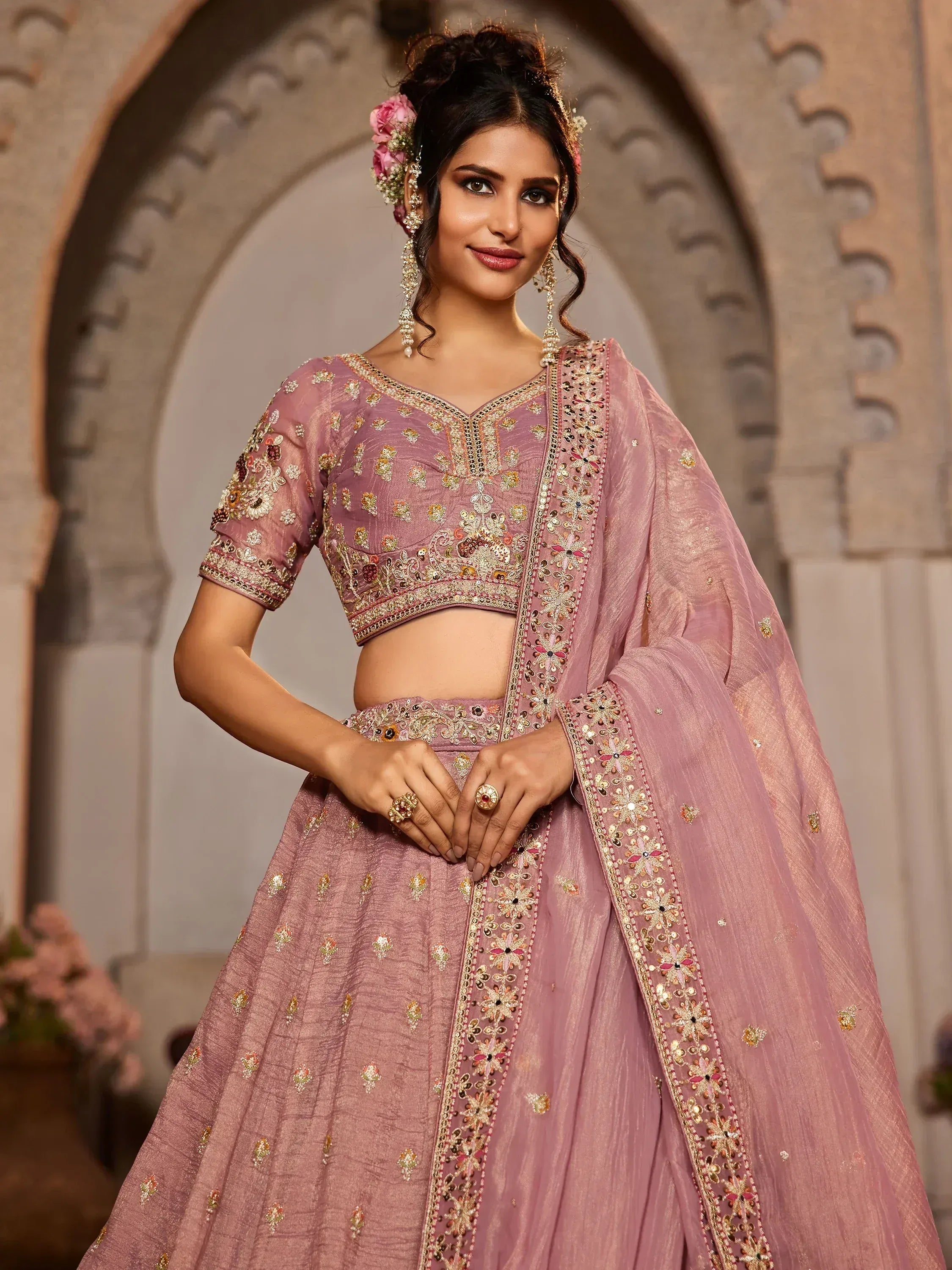 Pink embroidered lehenga choli with floral detailing, perfect for Indian weddings and festive occasions