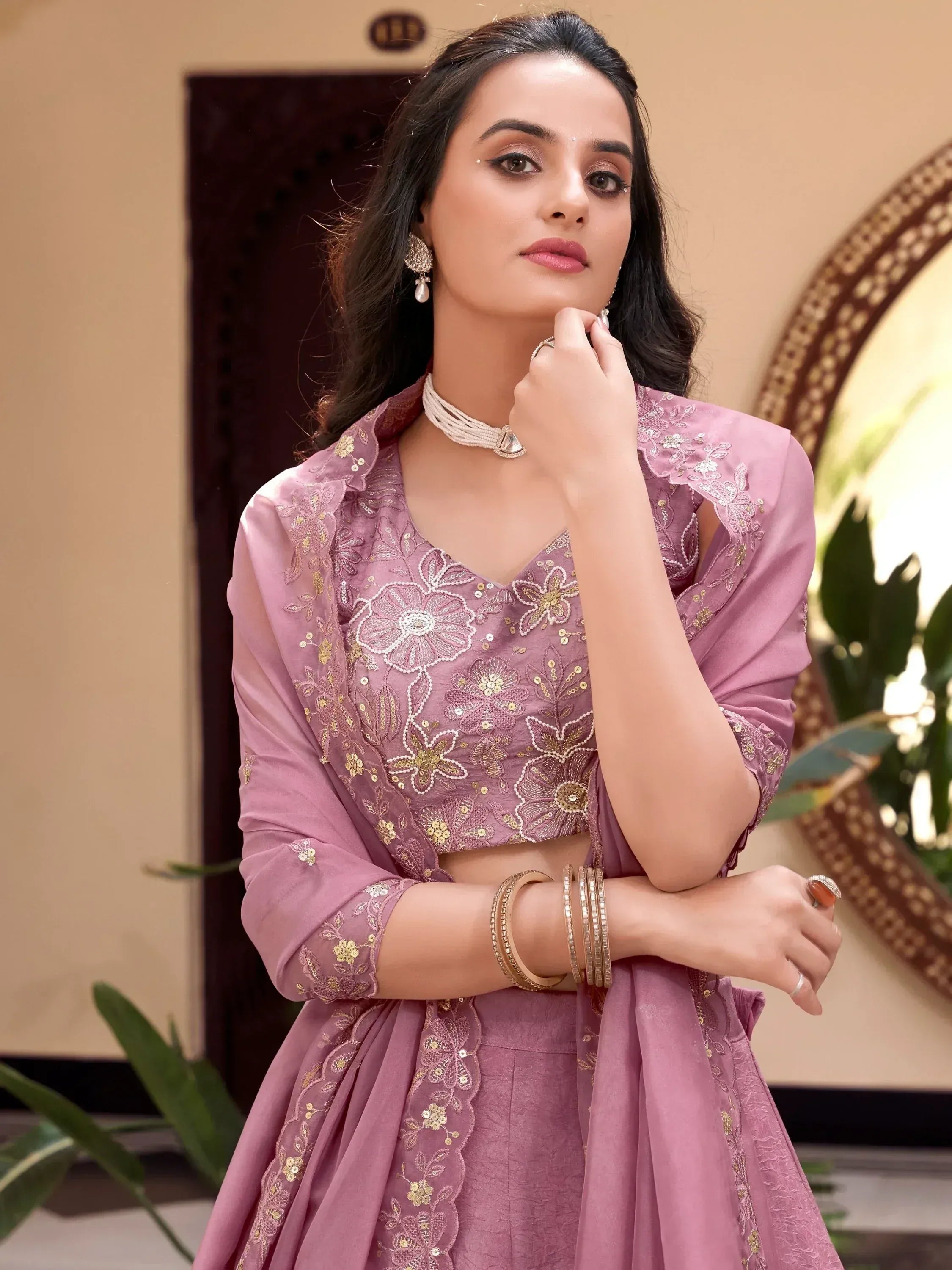 Pink embroidered lehenga choli with floral gold detailing, perfect for Indian ethnic occasions
