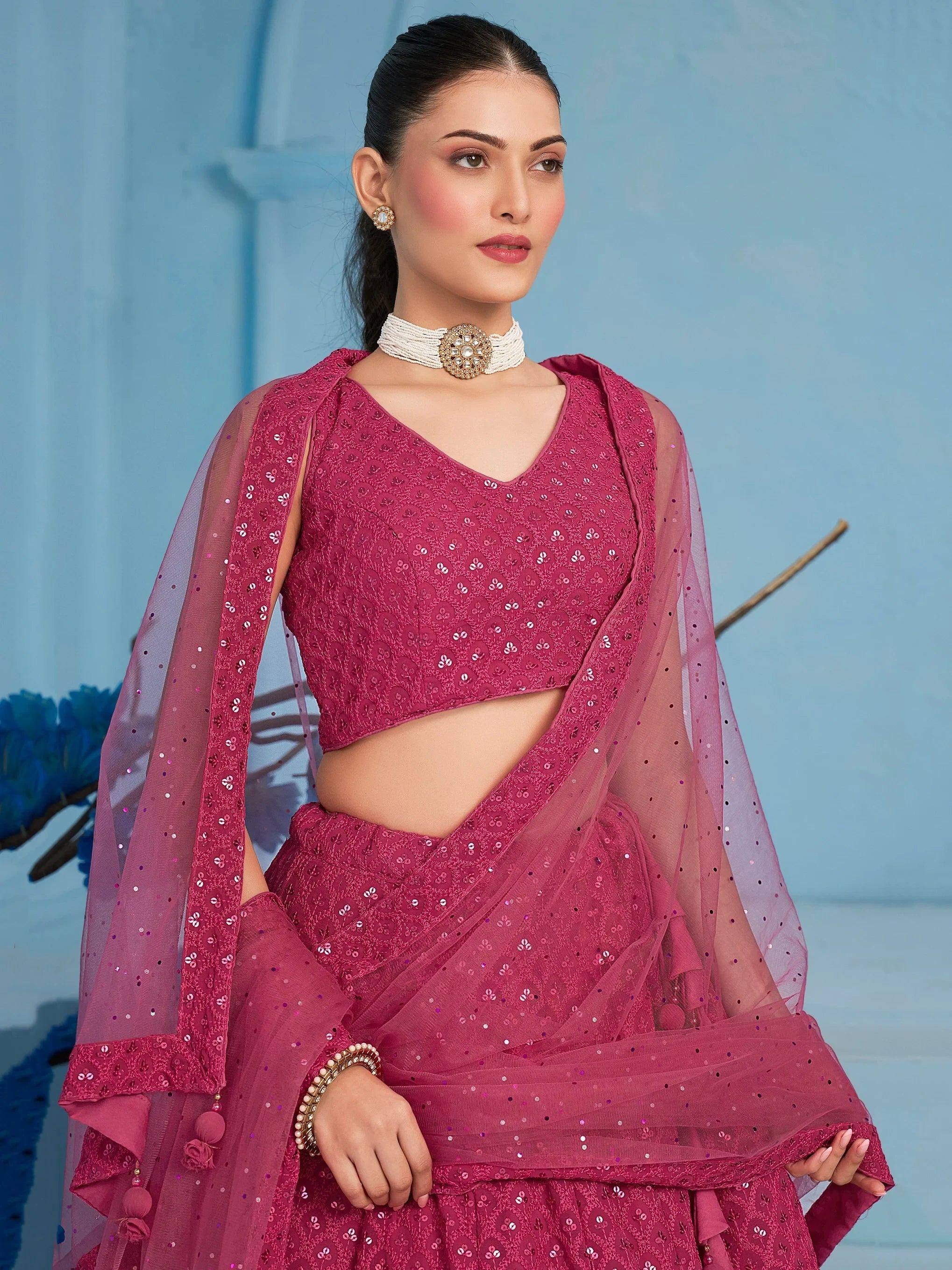 Pink sequined lehenga choli with sheer dupatta, ethnic Indian wear for weddings and festivals