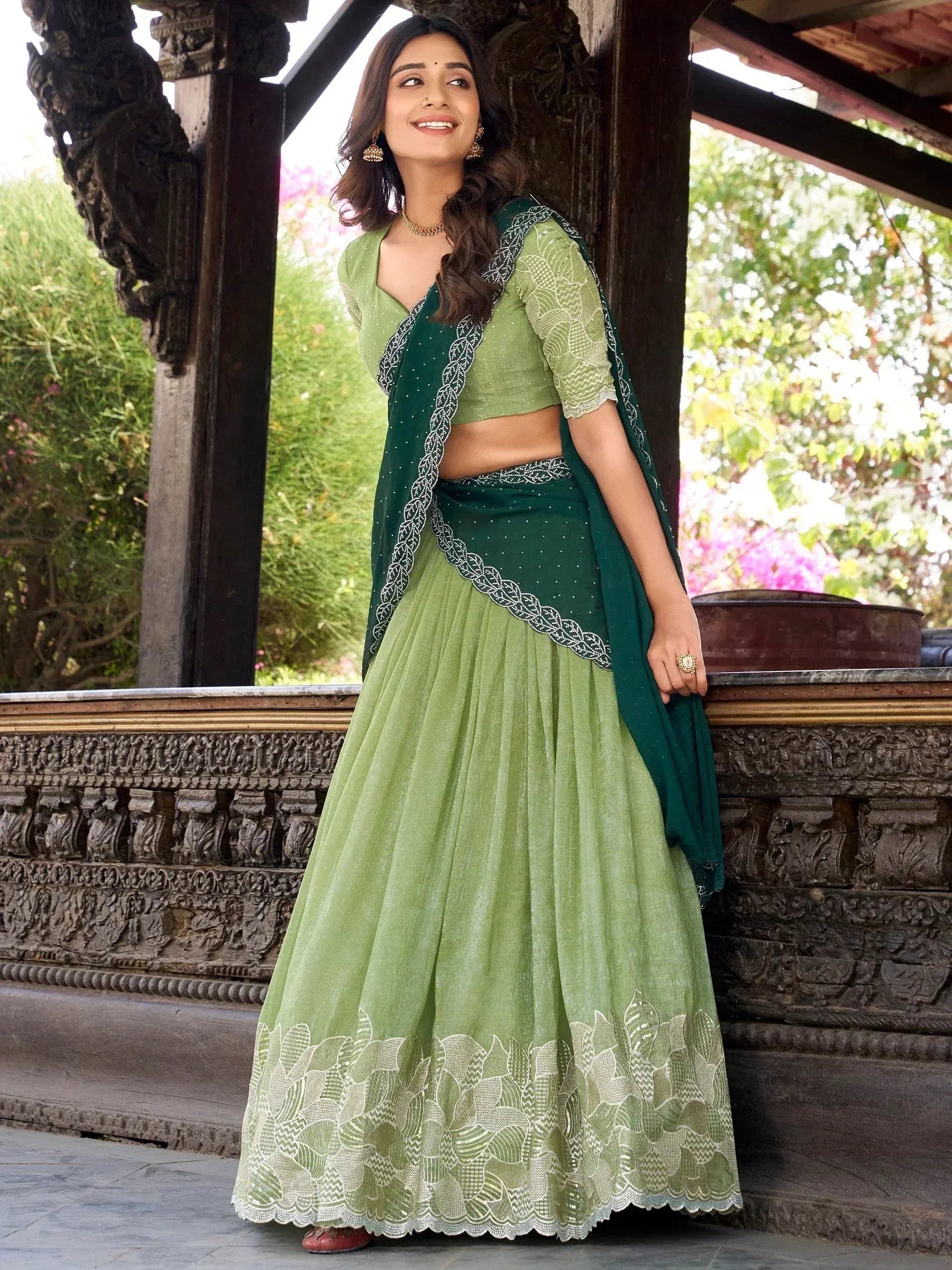 Green embroidered lehenga choli with matching dupatta, traditional Indian ethnic wear for women