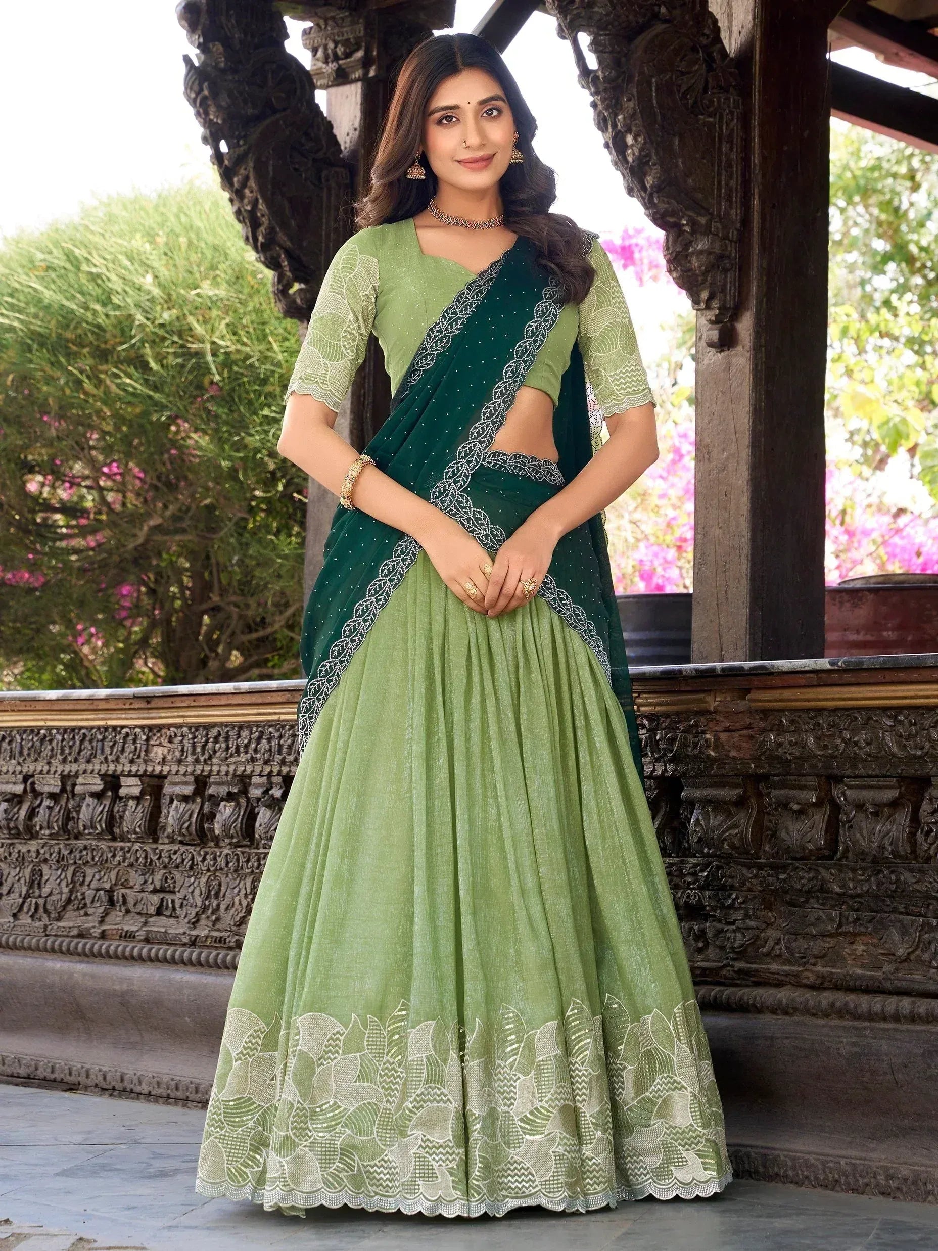 Green designer lehenga choli with embroidered border, perfect for Indian ethnic wear occasions