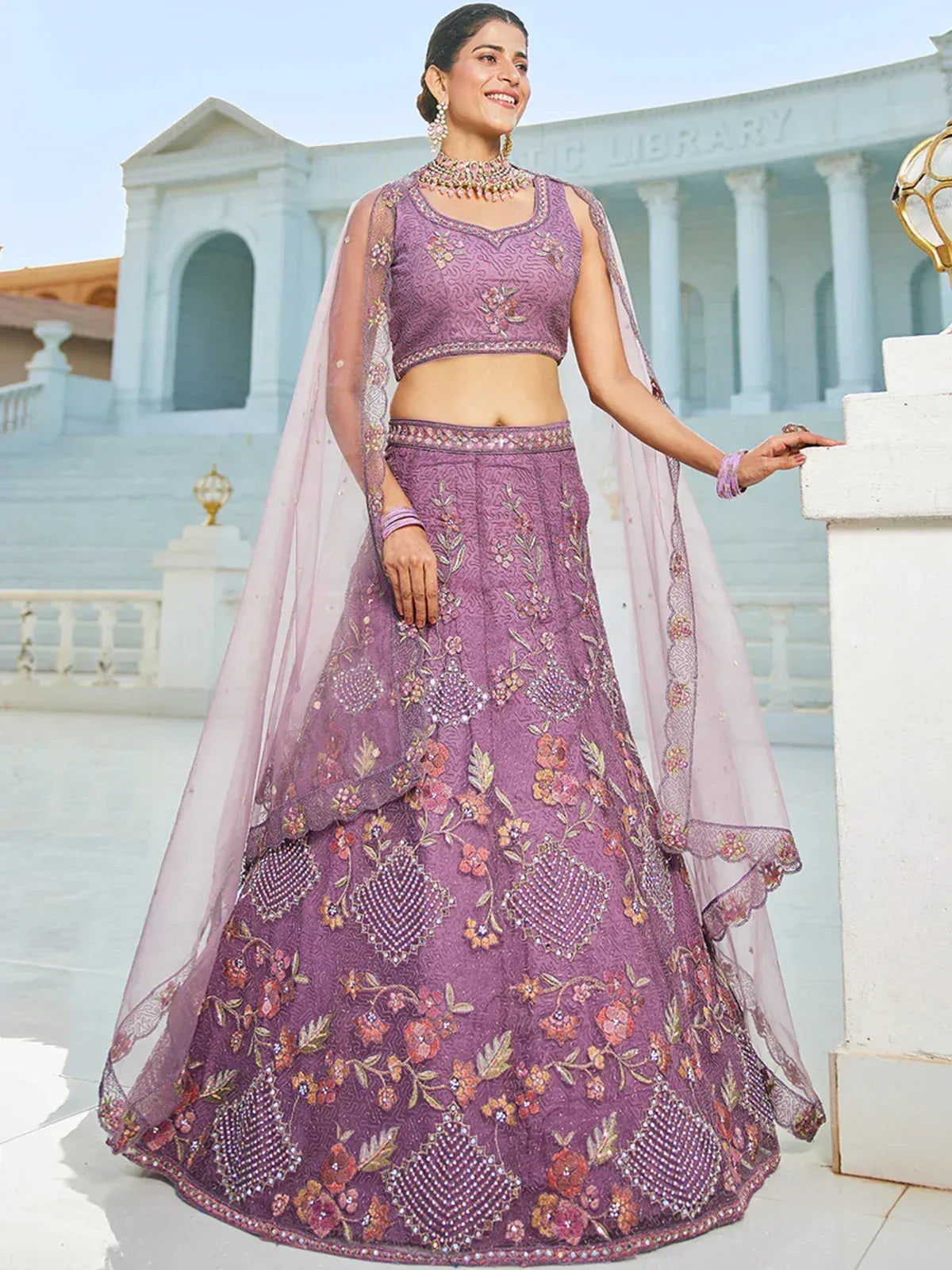 Purple floral embroidered lehenga choli with sheer dupatta, perfect for Indian weddings and festive occasions