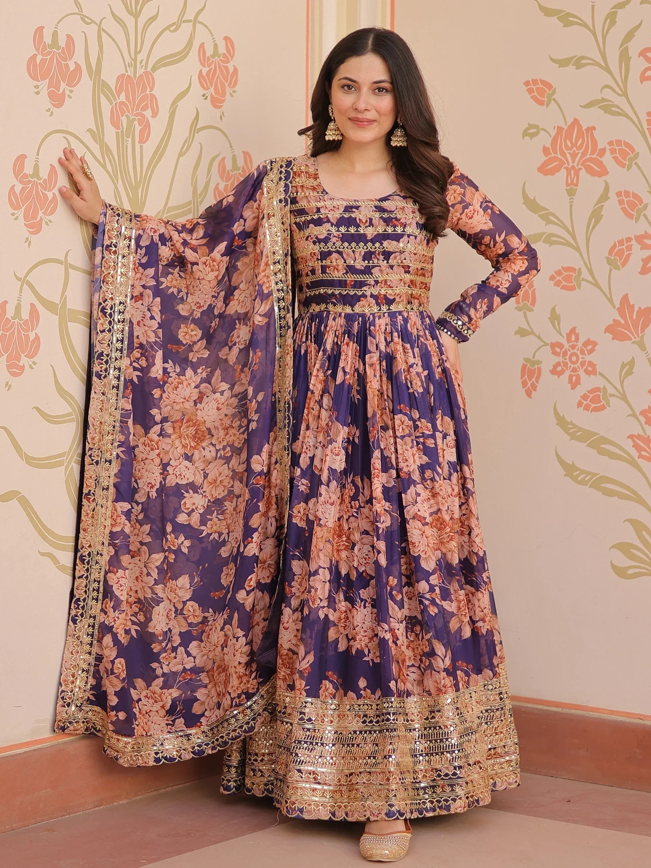 Purple floral ethnic gown with gold embroidery, perfect for Indian celebrations and events.