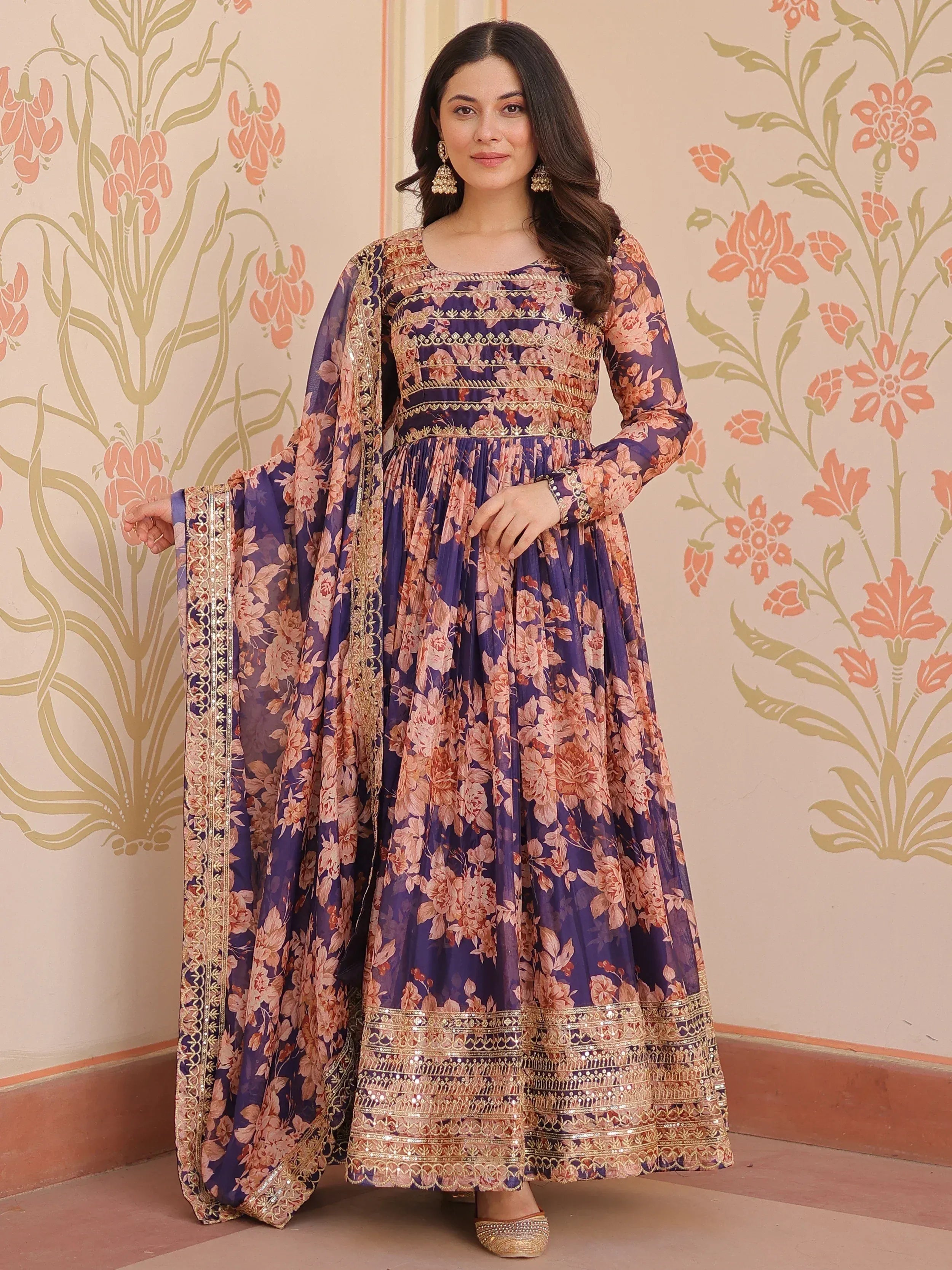 Purple floral ethnic gown with gold embroidery, perfect for Indian occasions and festive wear.
