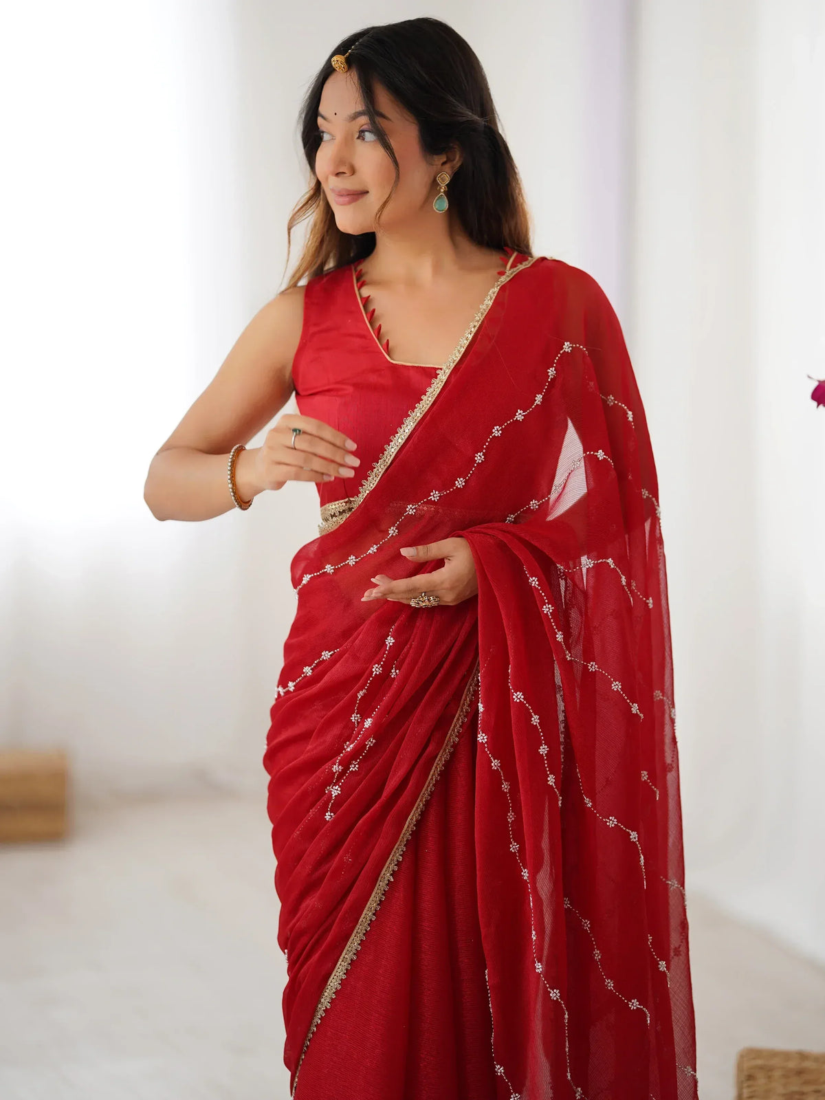 Red embroidered saree with gold border, perfect for Indian ethnic wear and festive occasions.