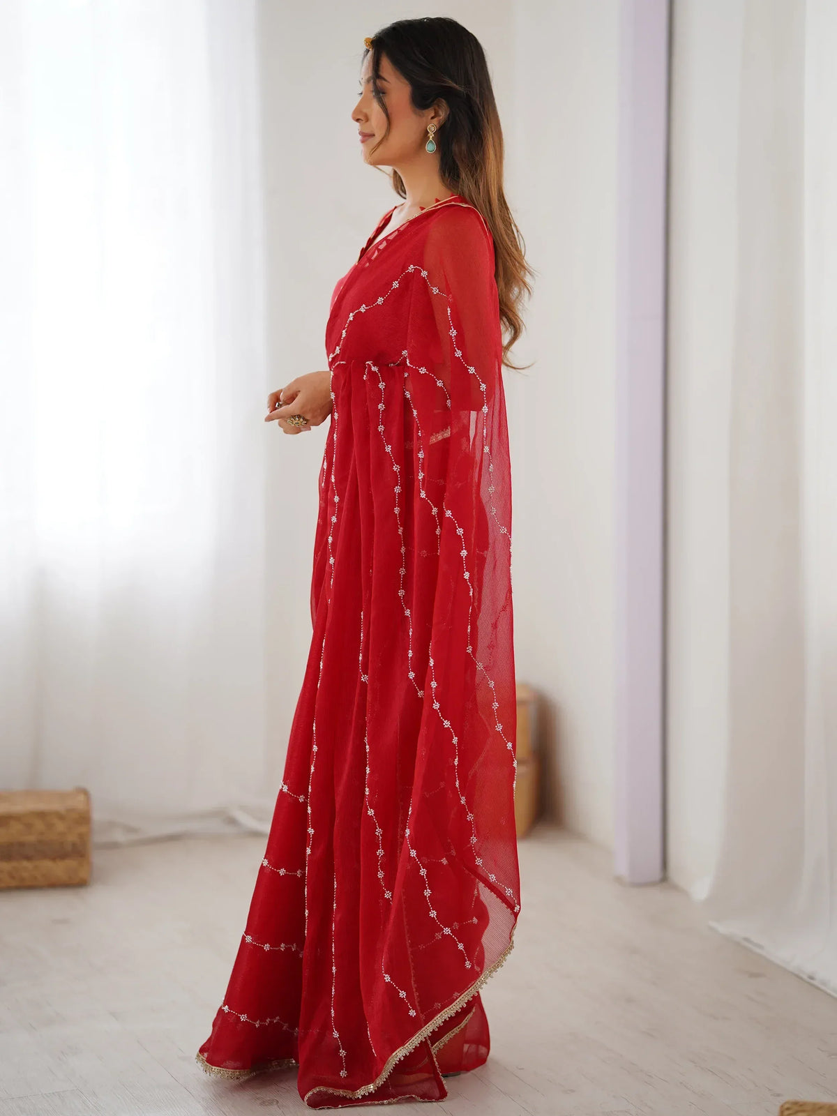 Red embroidered ethnic gown with sheer sleeves and floral detailing, perfect for Indian occasions