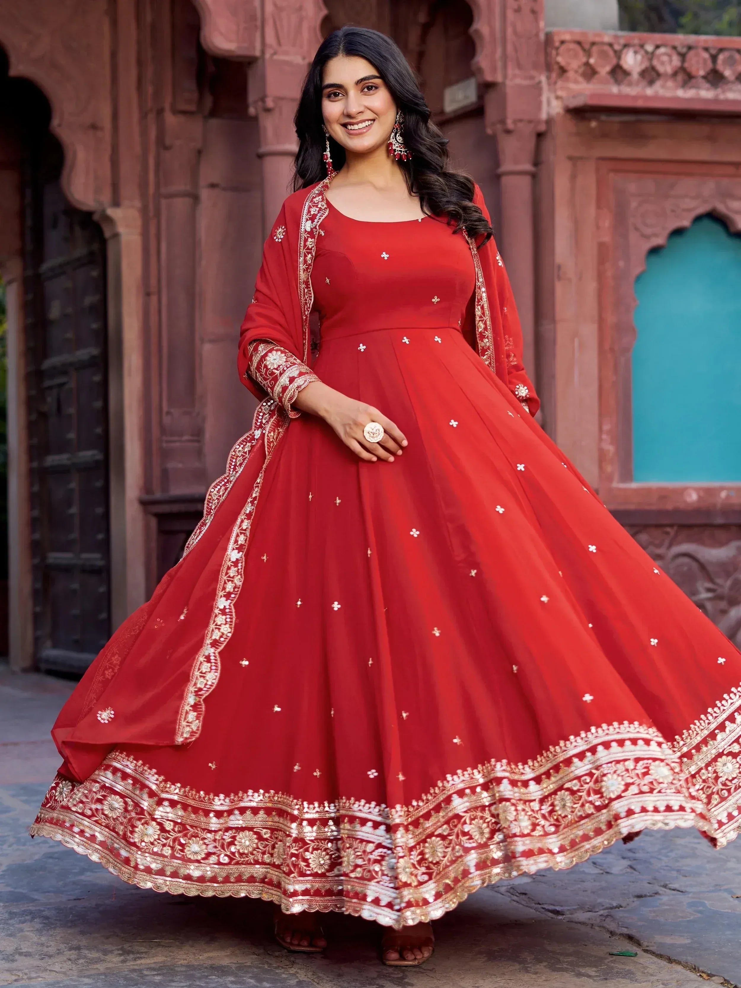 Red embroidered anarkali gown with gold detailing, perfect for Indian ethnic wear and festive occasions.