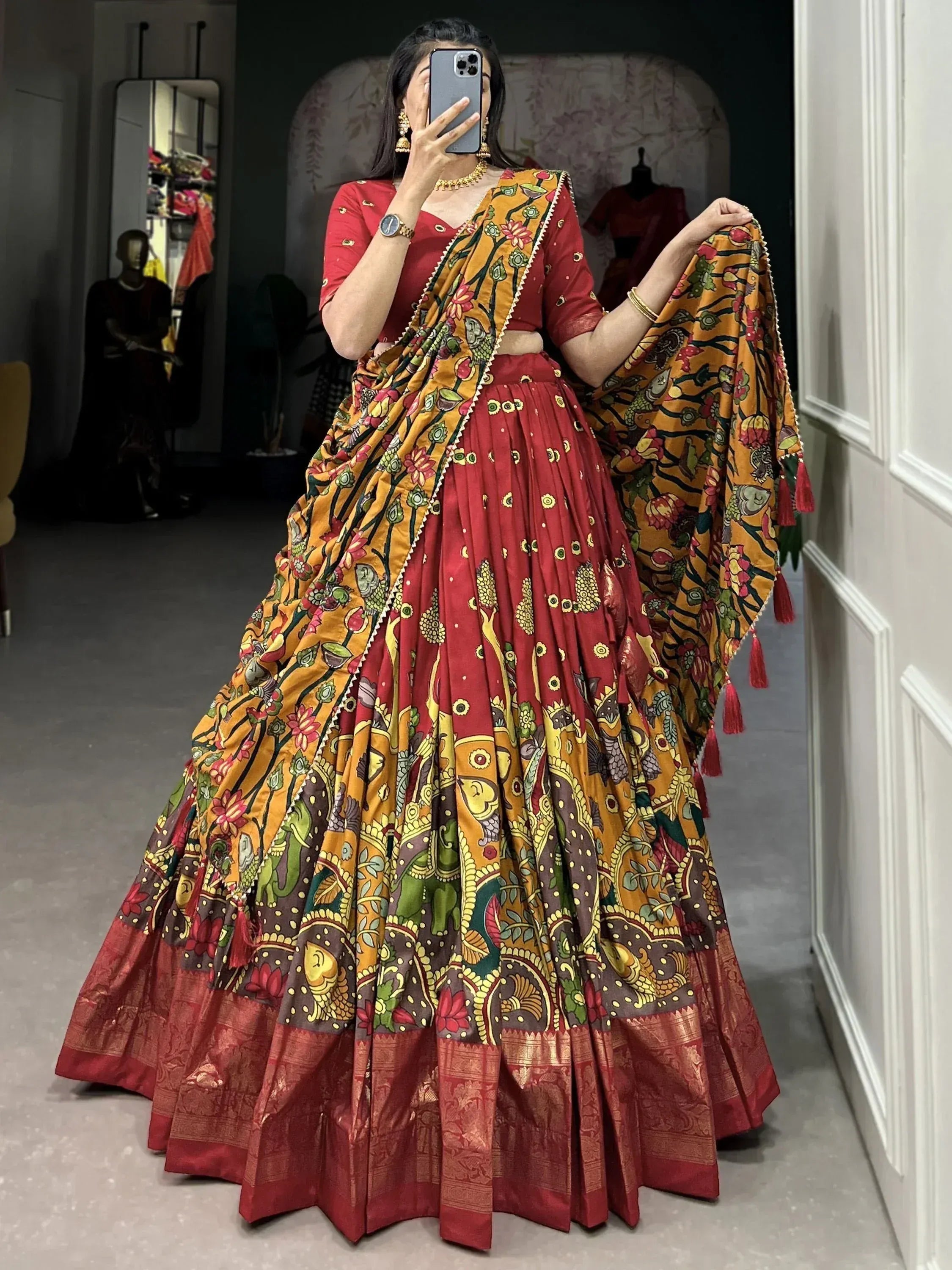 Red and mustard printed lehenga choli with floral and elephant motifs, perfect for Indian ethnic wear