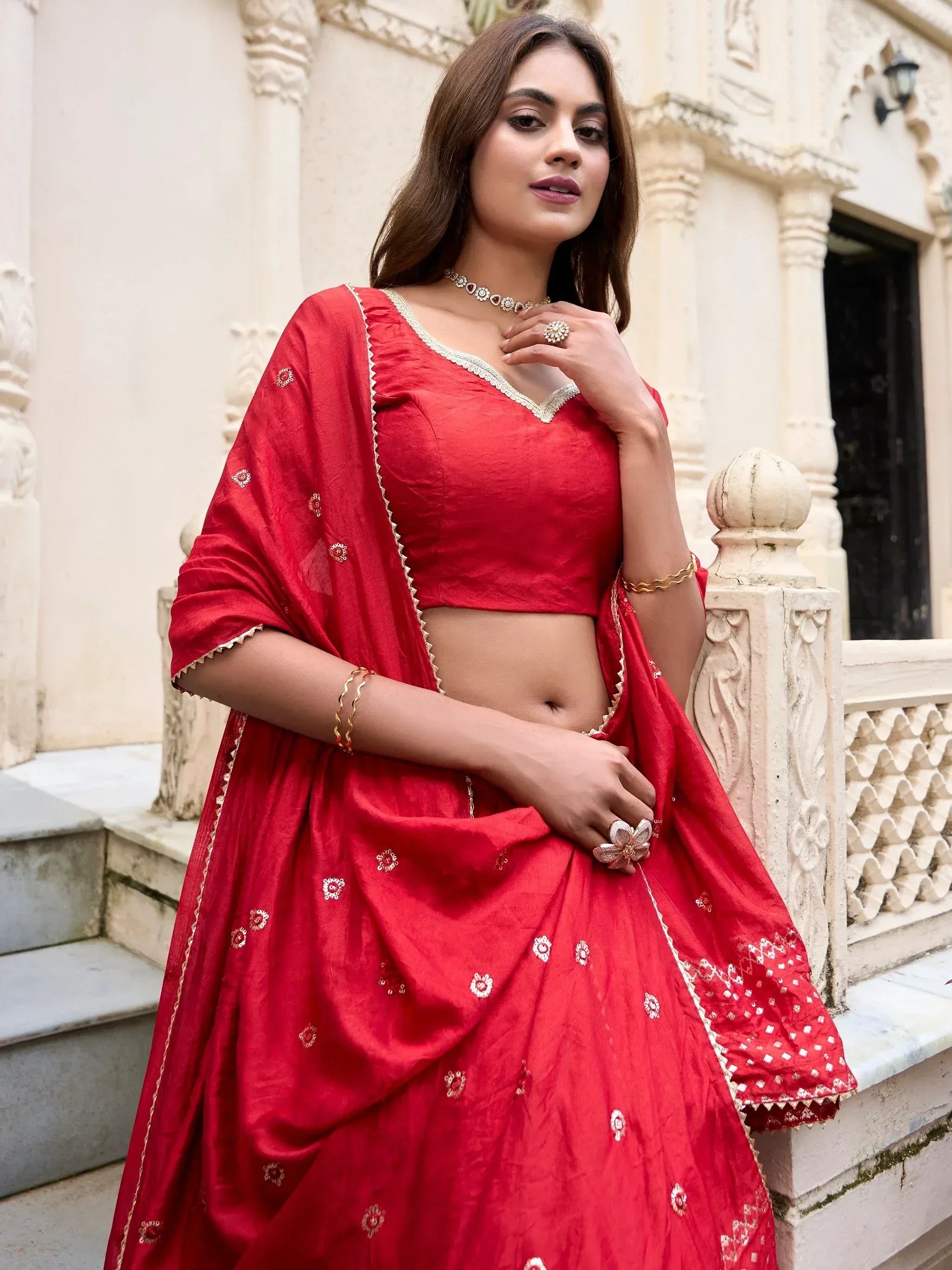 Red embroidered lehenga choli with gold detailing, perfect for Indian ethnic wear occasions