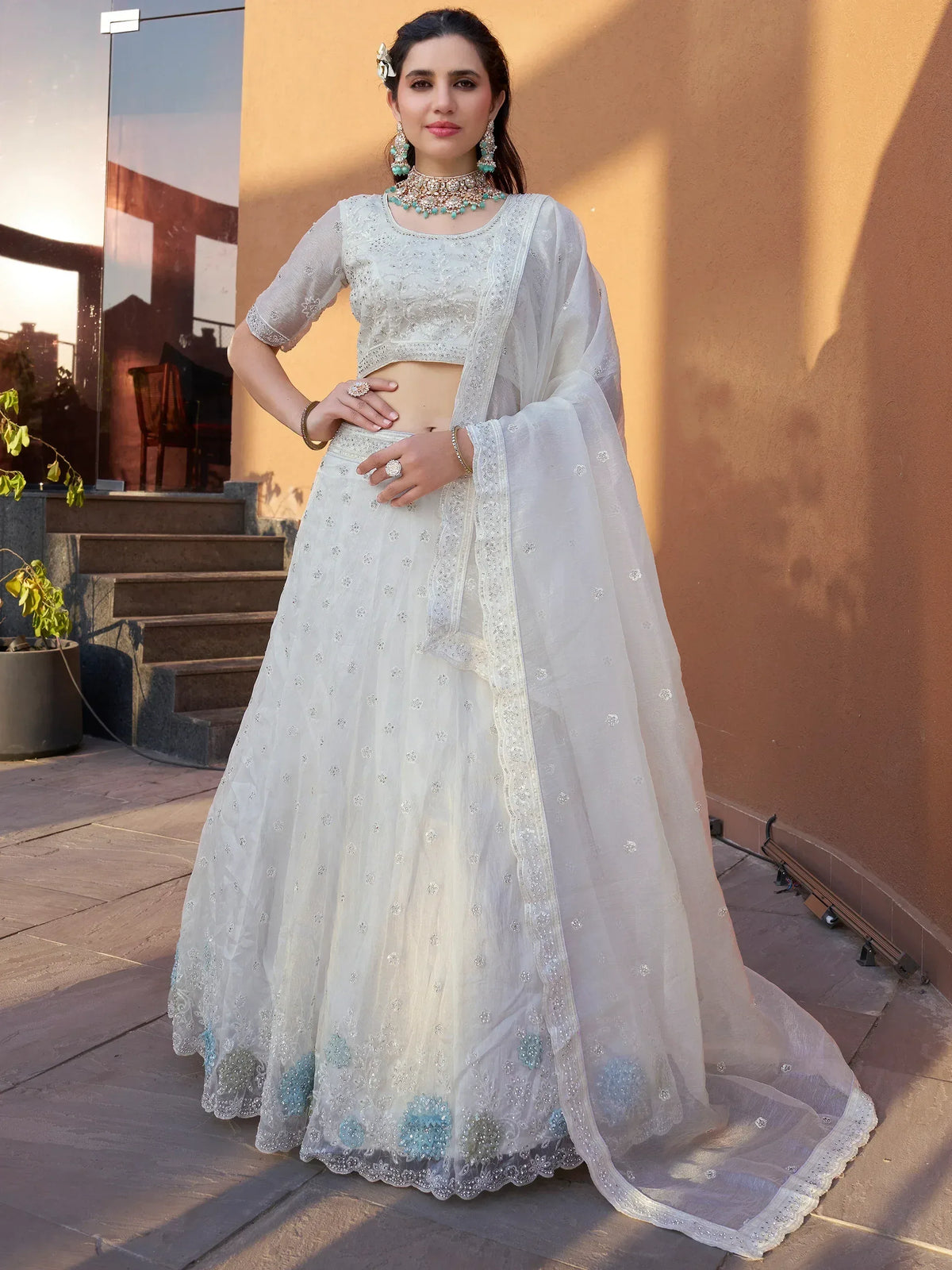 Elegant white embroidered lehenga choli with sheer dupatta, perfect for Indian ethnic wear occasions
