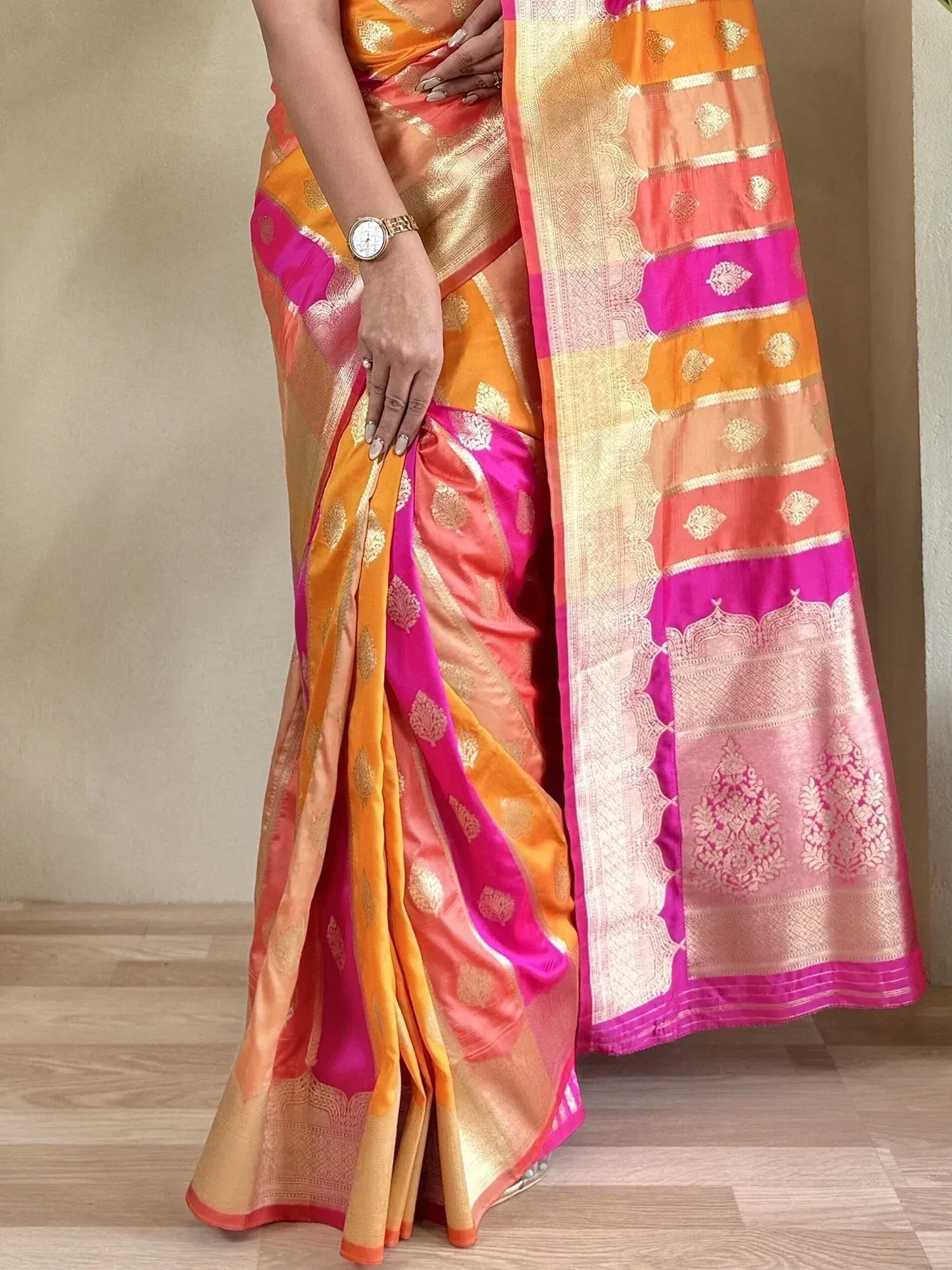 Vibrant orange pink silk saree with gold zari work, perfect for Indian ethnic occasions and festivals.