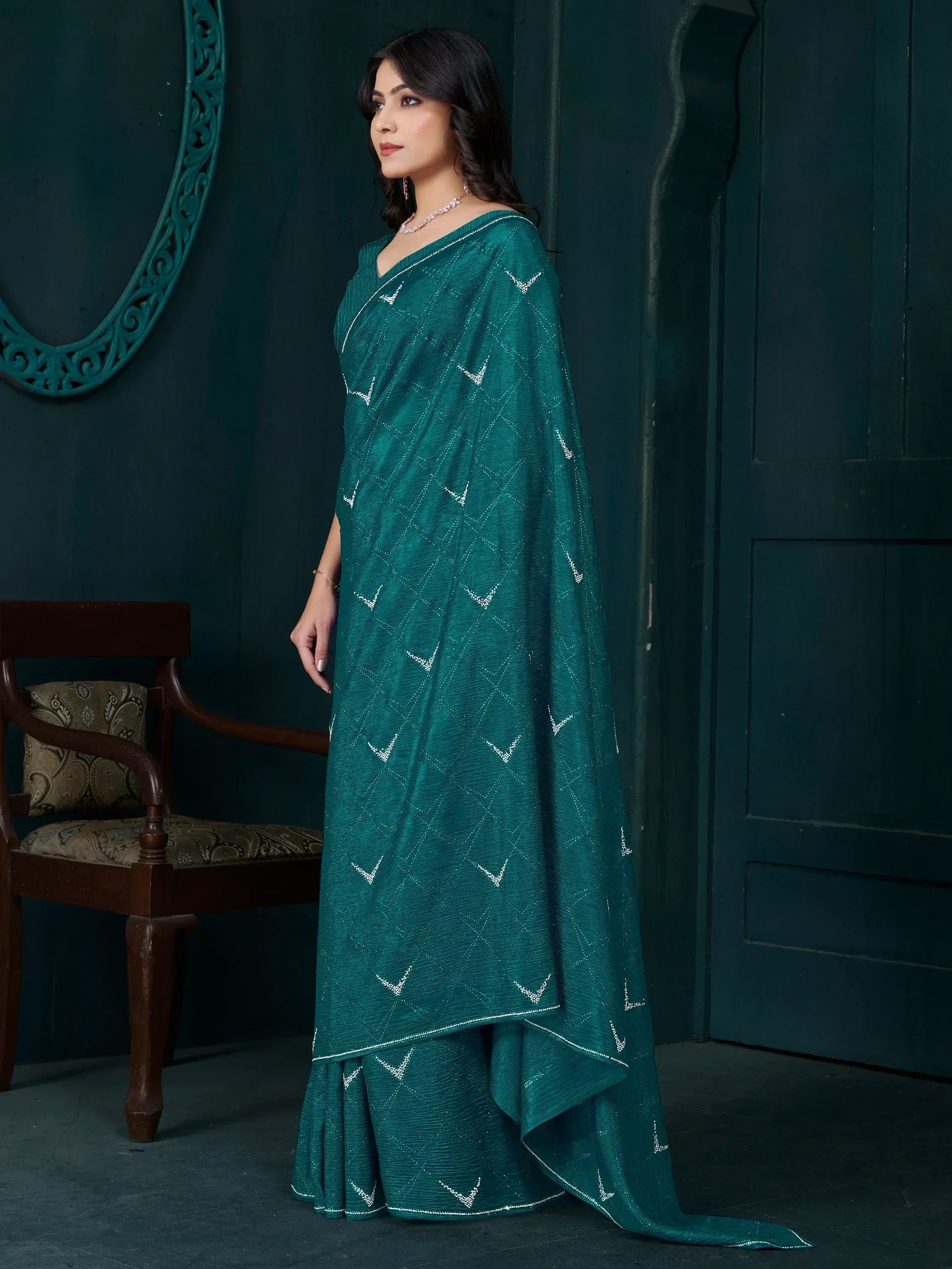 Emerald green designer saree with silver geometric embroidery, elegant ethnic wear for women