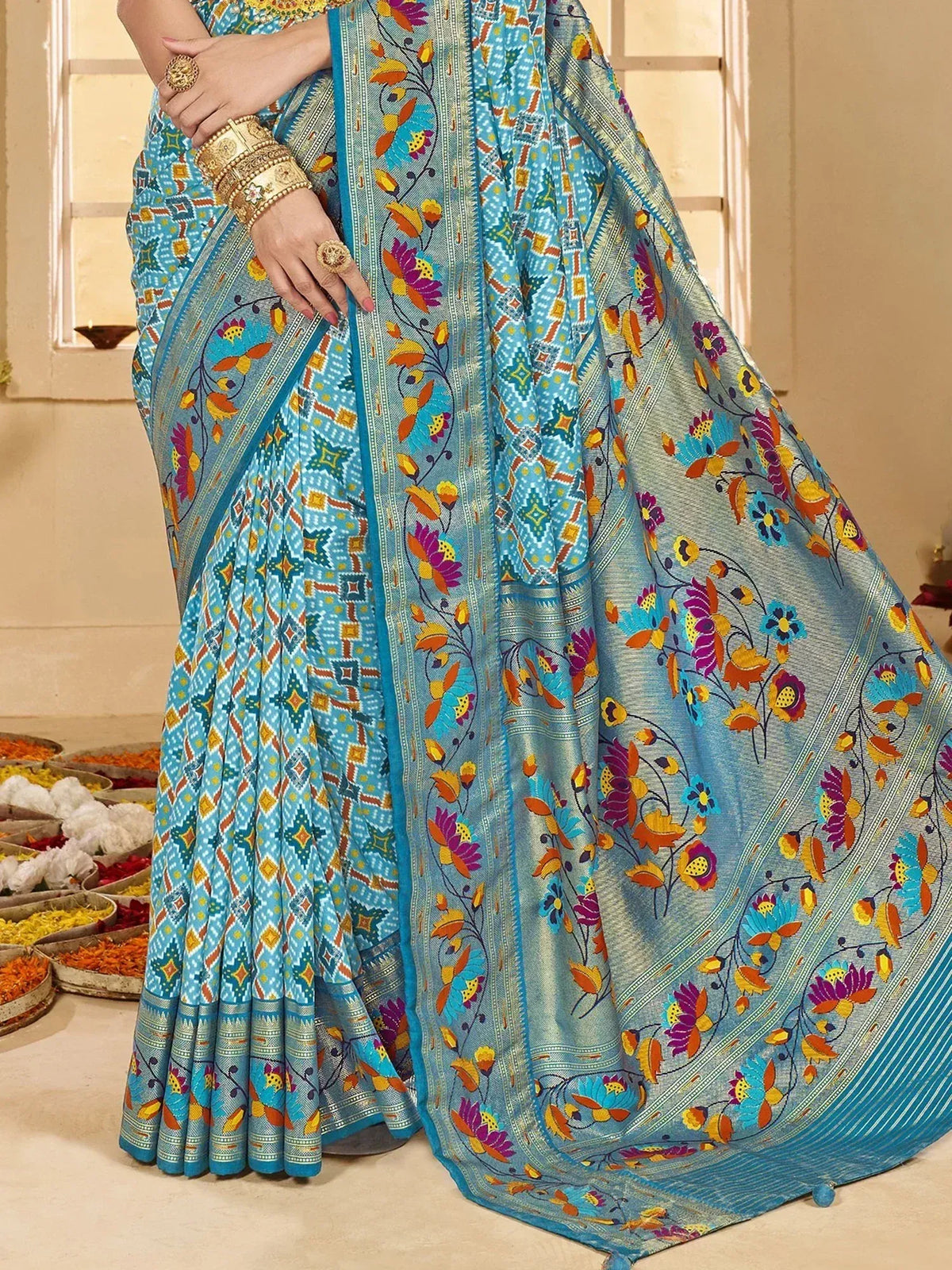 Blue floral printed saree with geometric border, traditional Indian ethnic wear for women
