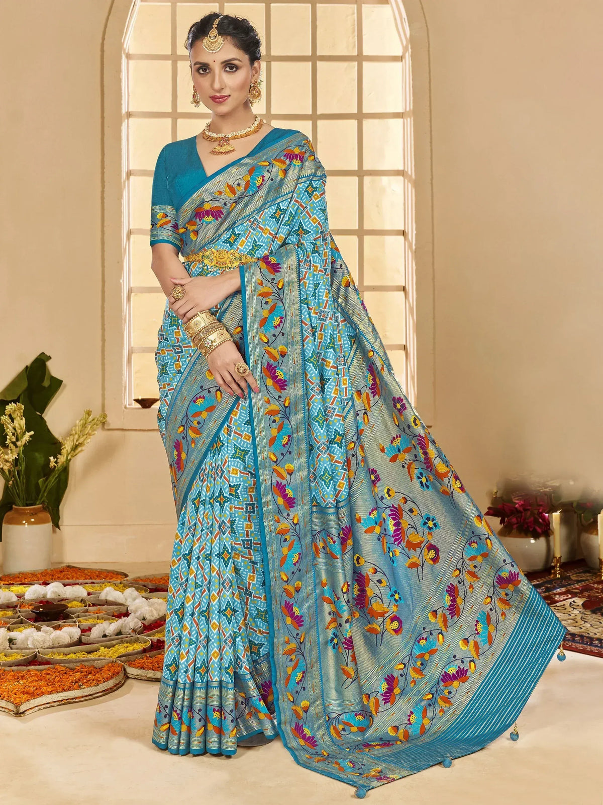 Blue floral printed saree with gold border, perfect for Indian ethnic wear and festive occasions