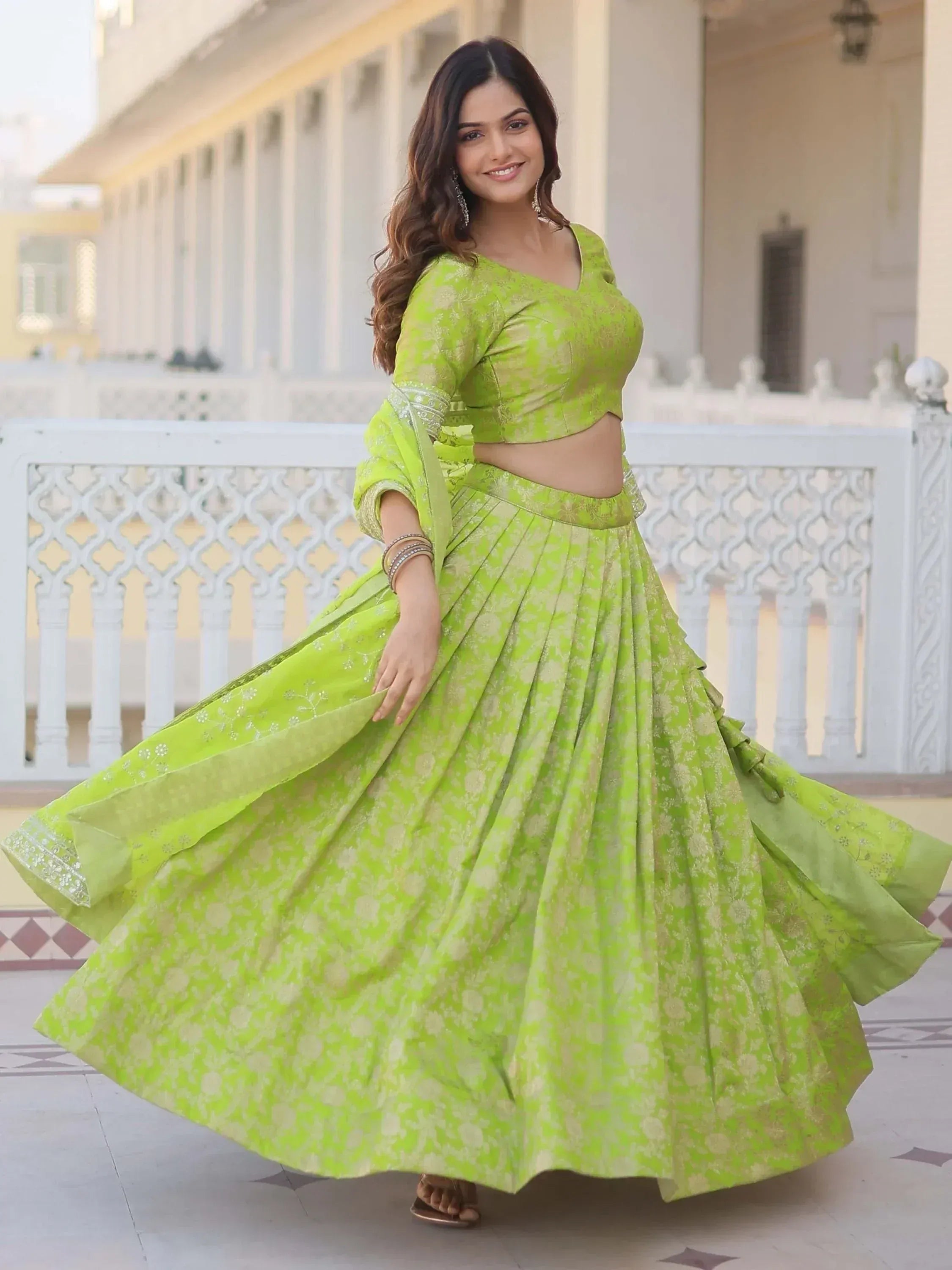 Vibrant green floral lehenga choli with flared skirt, perfect for Indian ethnic wear and festive occasions.
