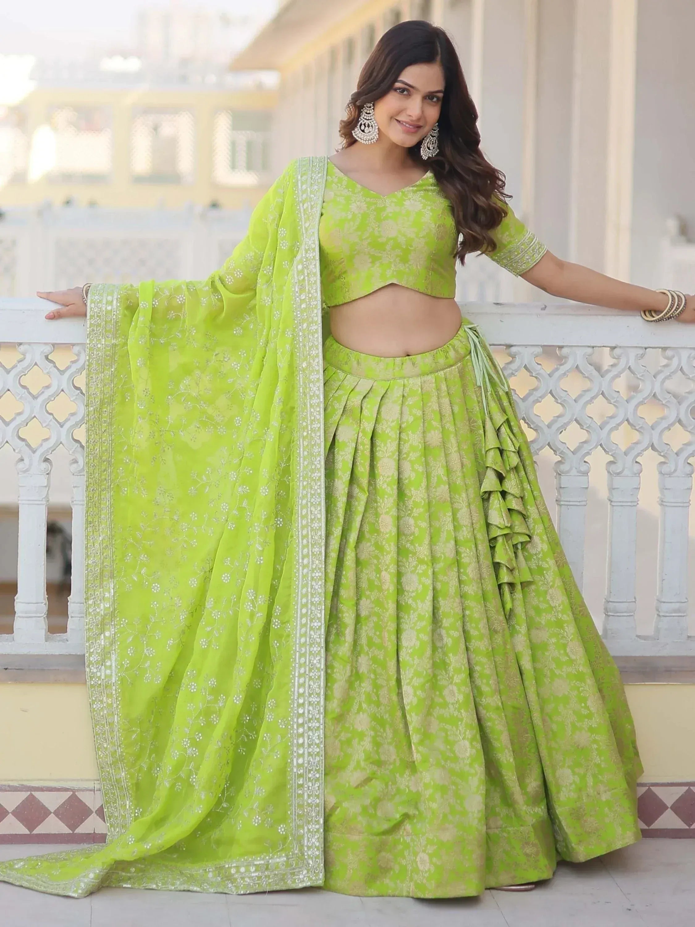 Lime green designer lehenga choli with floral print and ruffle detailing, perfect for Indian ethnic wear occasions.