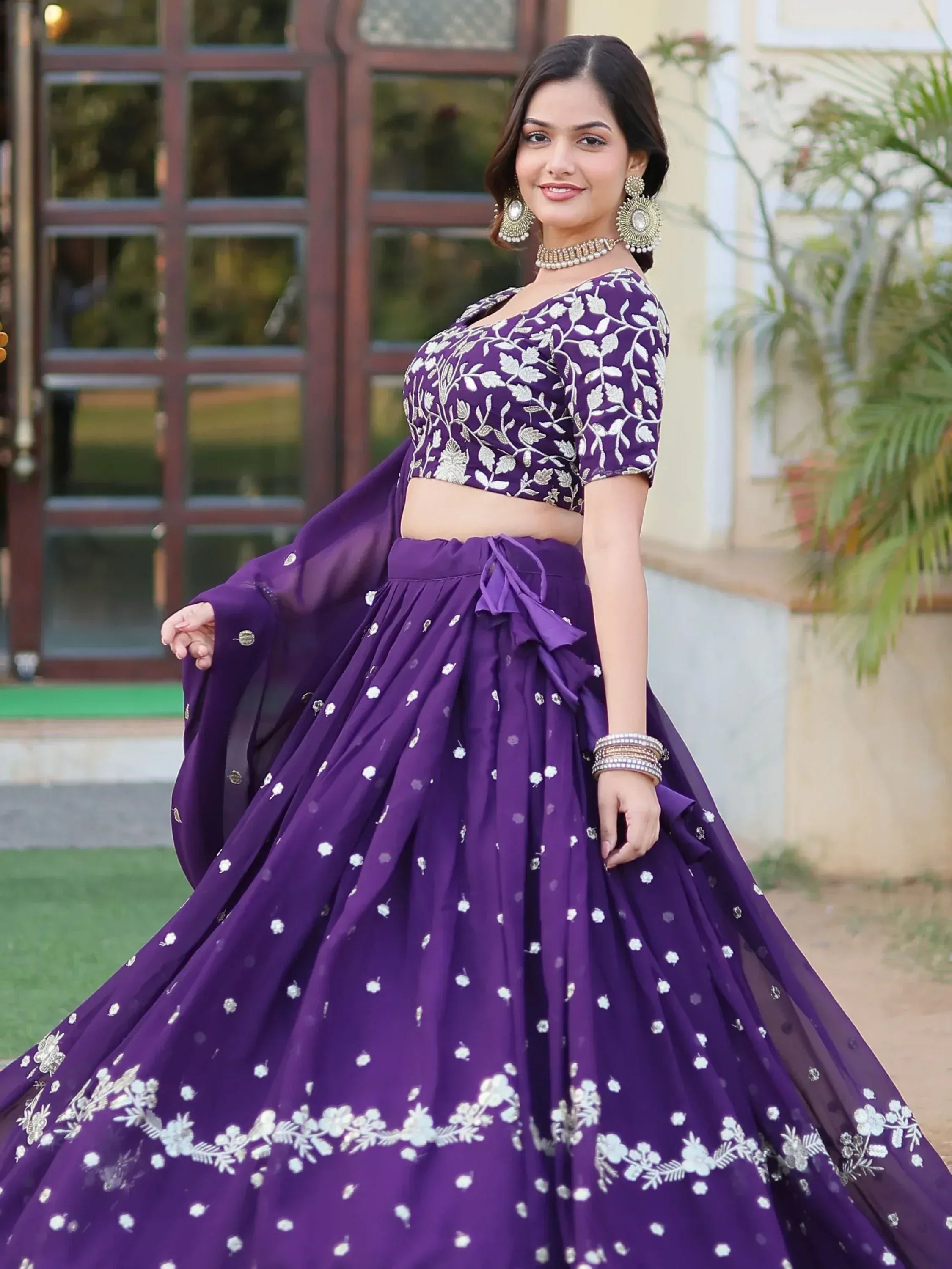 Purple embroidered lehenga choli with floral design, perfect for Indian ethnic wear occasions