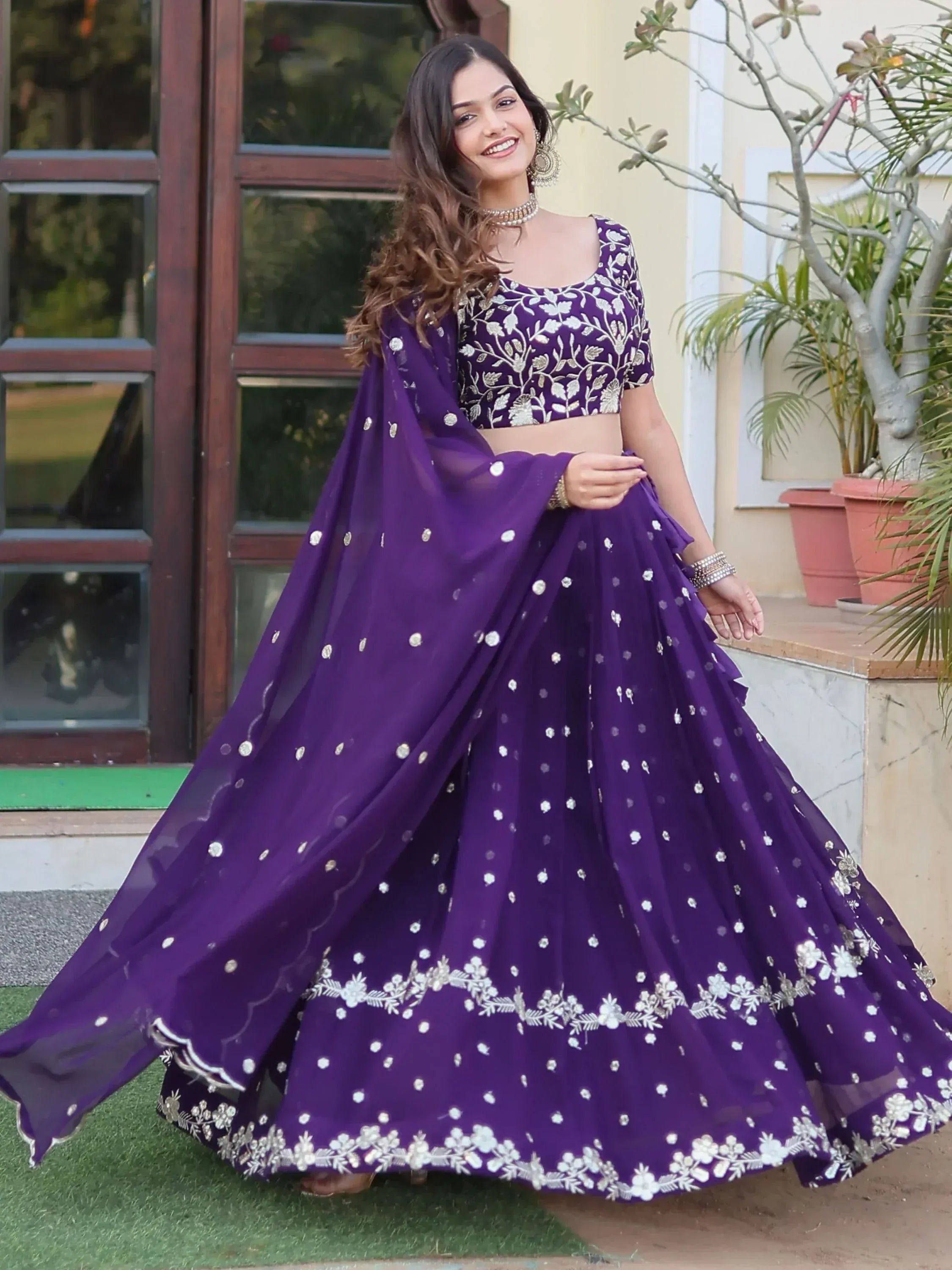Purple embroidered lehenga choli with floral motifs, perfect for Indian ethnic occasions