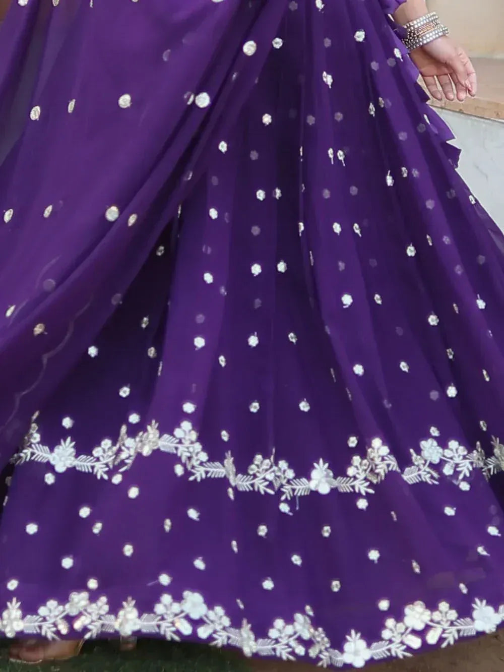 Purple lehenga with white floral embroidery and silver embellishments, perfect for ethnic occasions