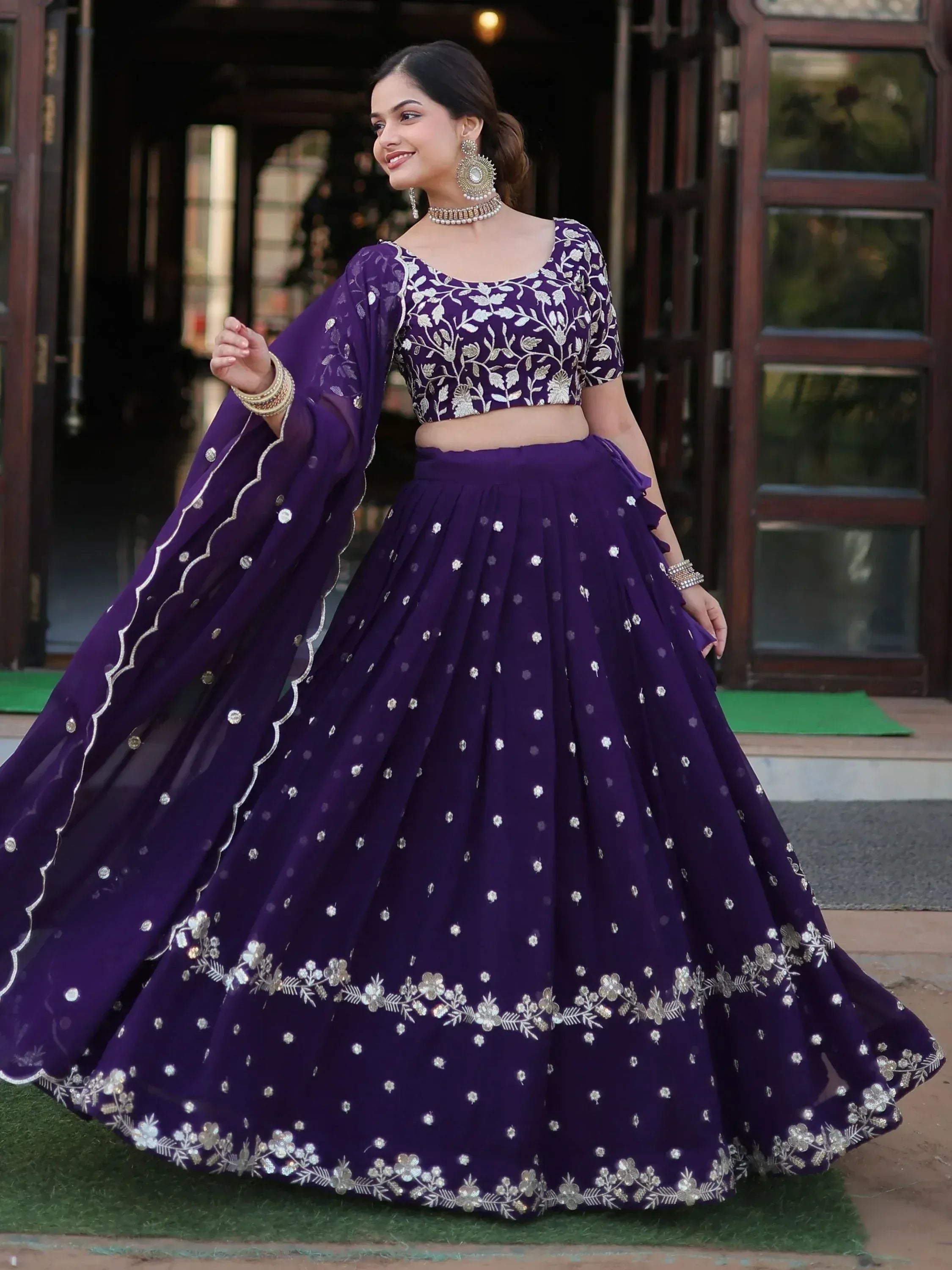 Purple embroidered lehenga choli with floral motifs, perfect for Indian ethnic wear and festive occasions.